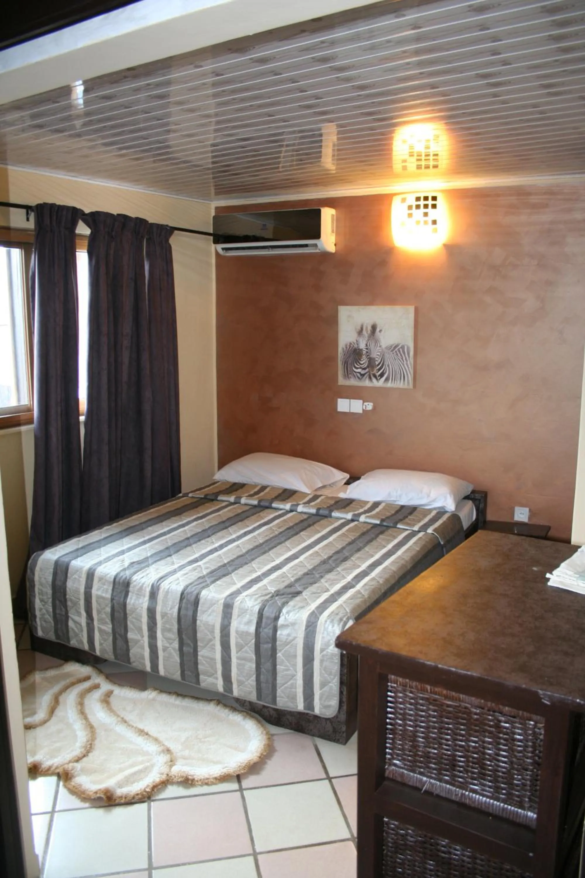 Bed in Hotel Napoleon Lagune