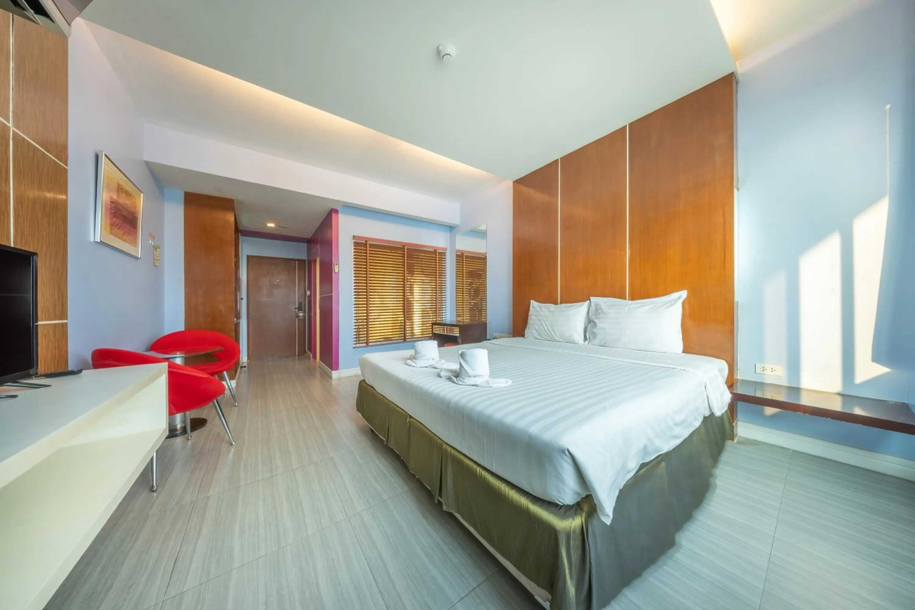 Bed in SHIN Hotel V-ONE Korat