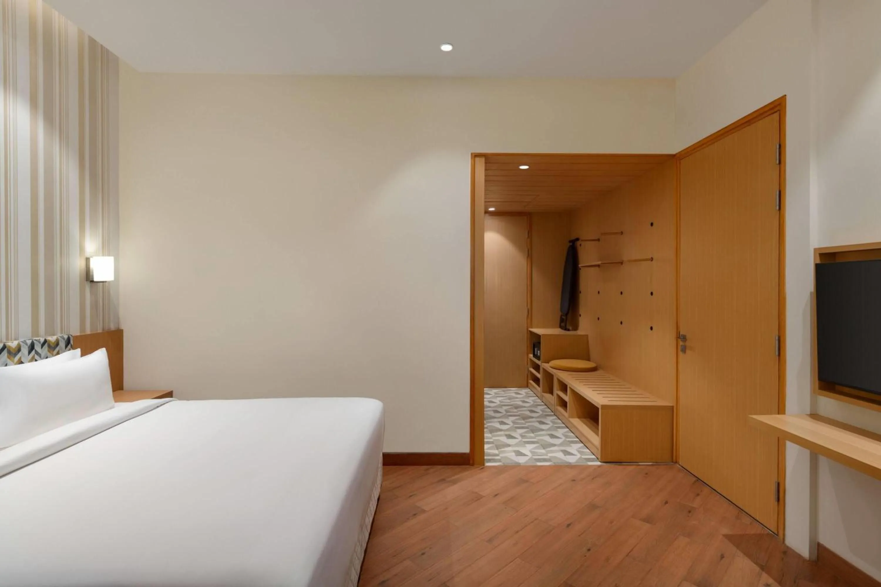 Photo of the whole room, Bed in Ramada Encore by Wyndham Lucknow Airport