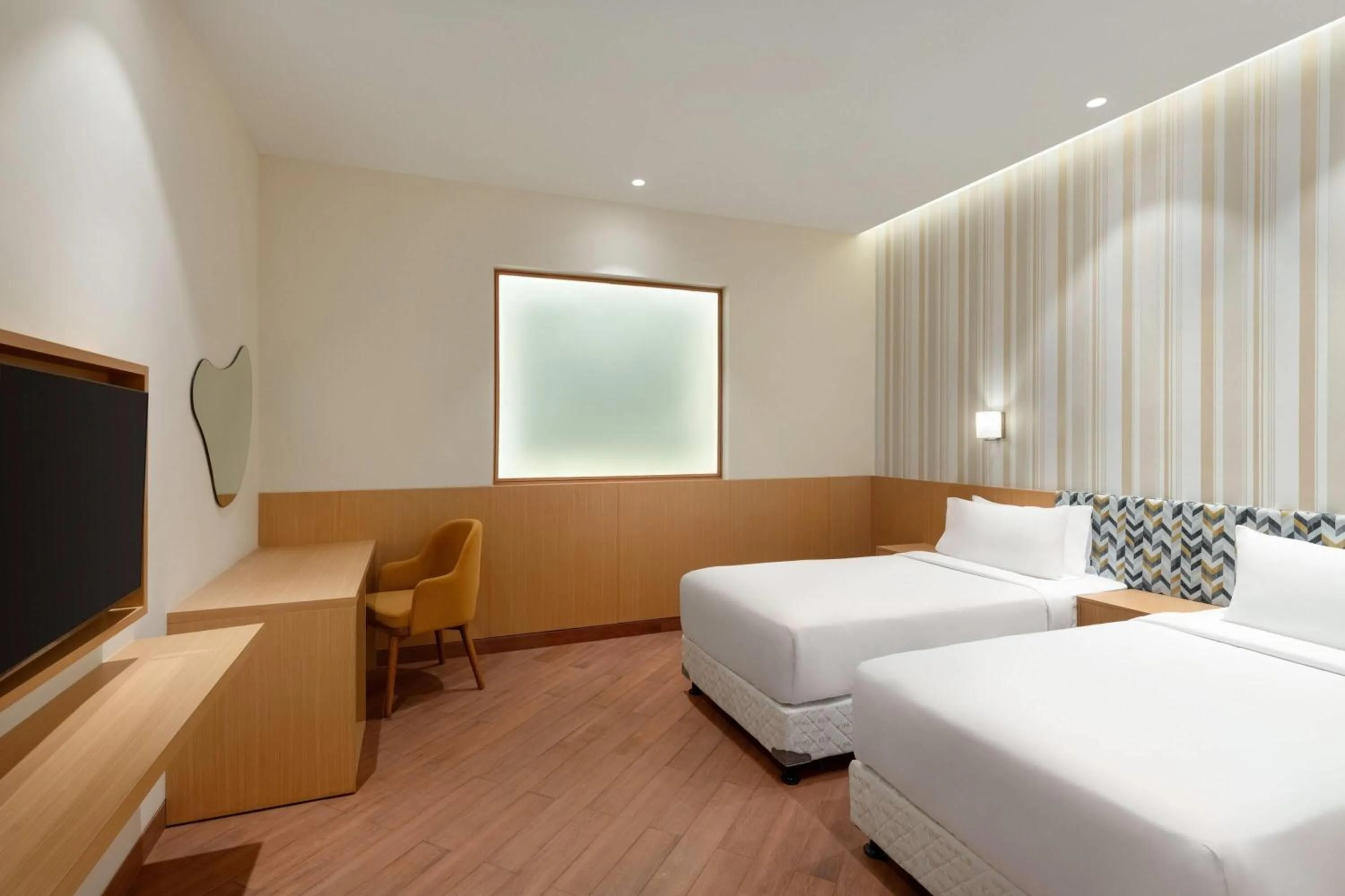 Photo of the whole room, Bed in Ramada Encore by Wyndham Lucknow Airport