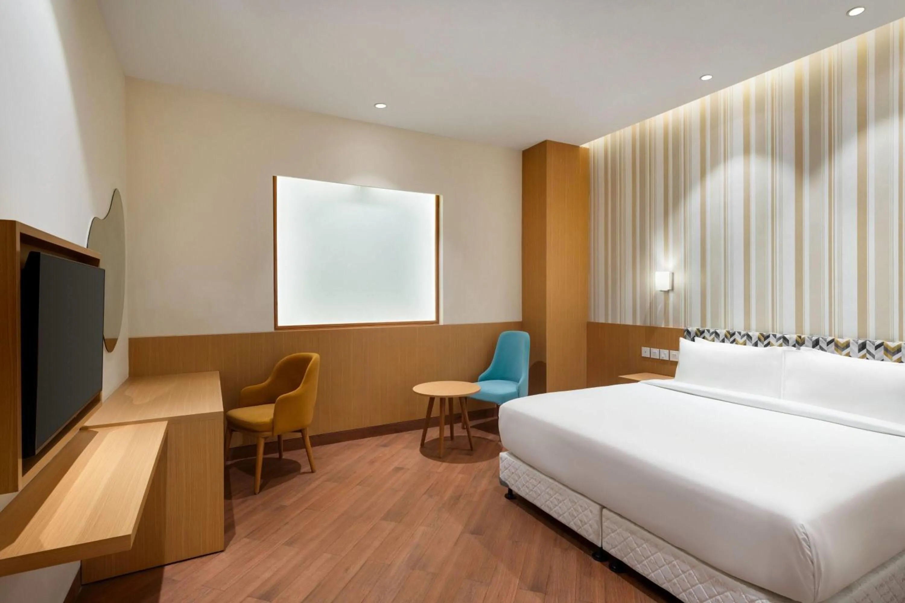 Photo of the whole room, Bed in Ramada Encore by Wyndham Lucknow Airport