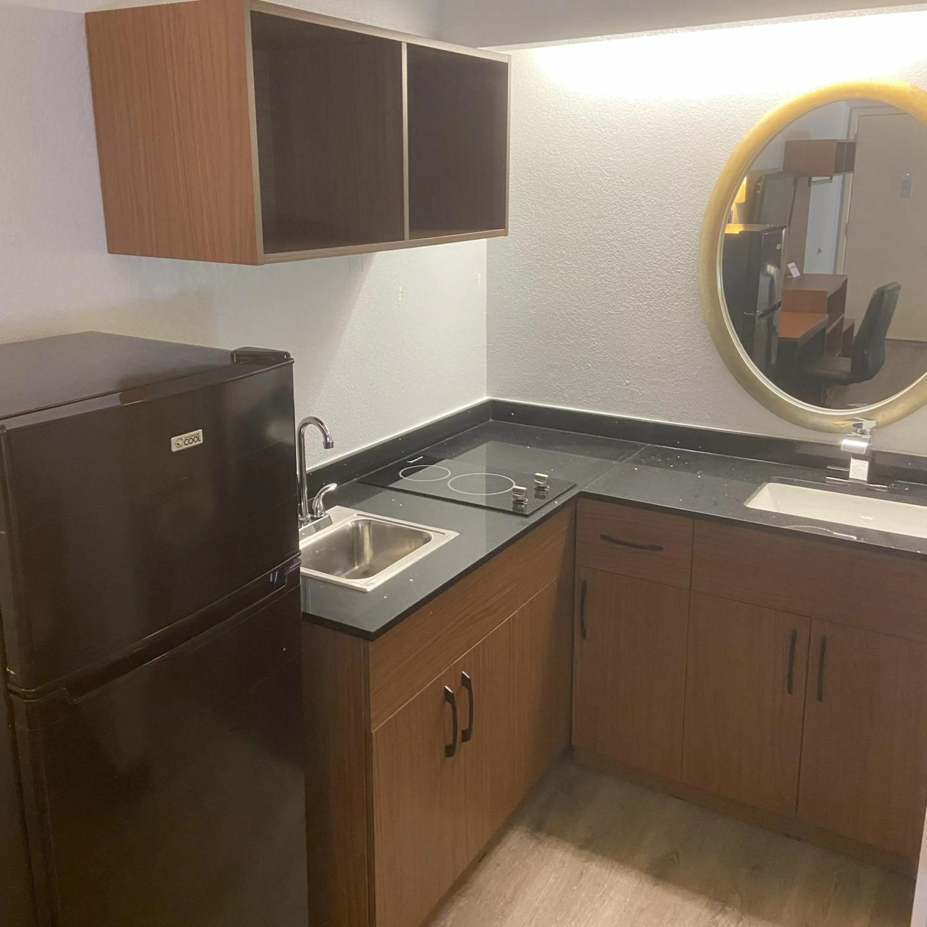 kitchen in HomeTowne Studios by Red Roof Buffalo - Niagara Airport