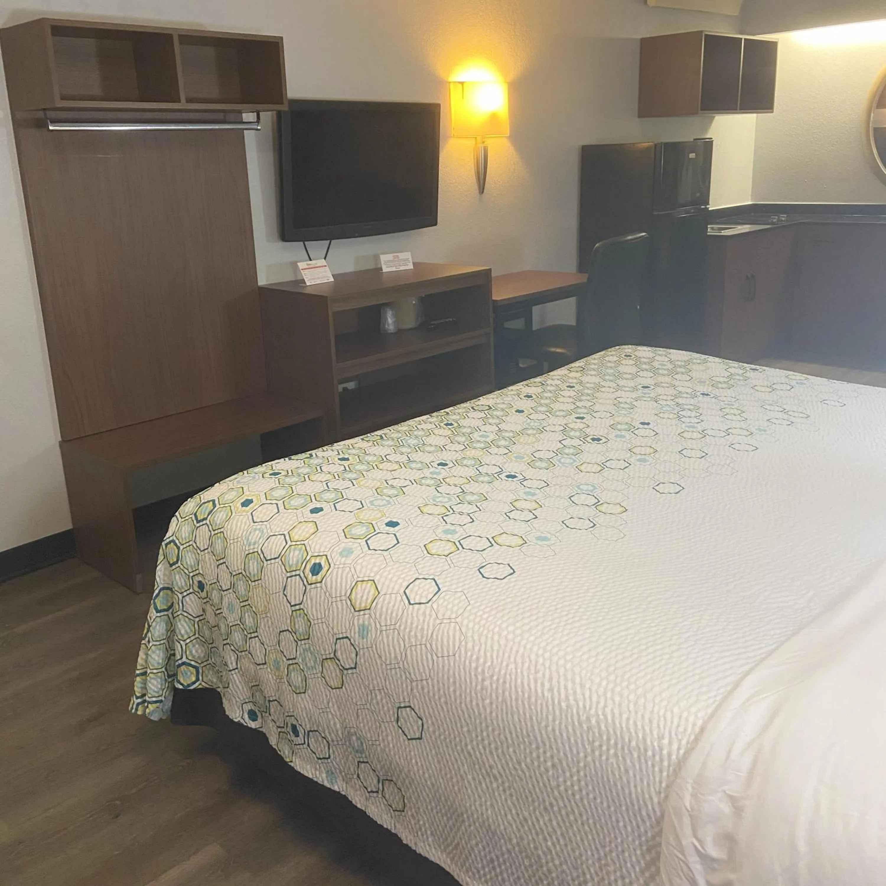 Bedroom, Bed in HomeTowne Studios by Red Roof Buffalo - Niagara Airport