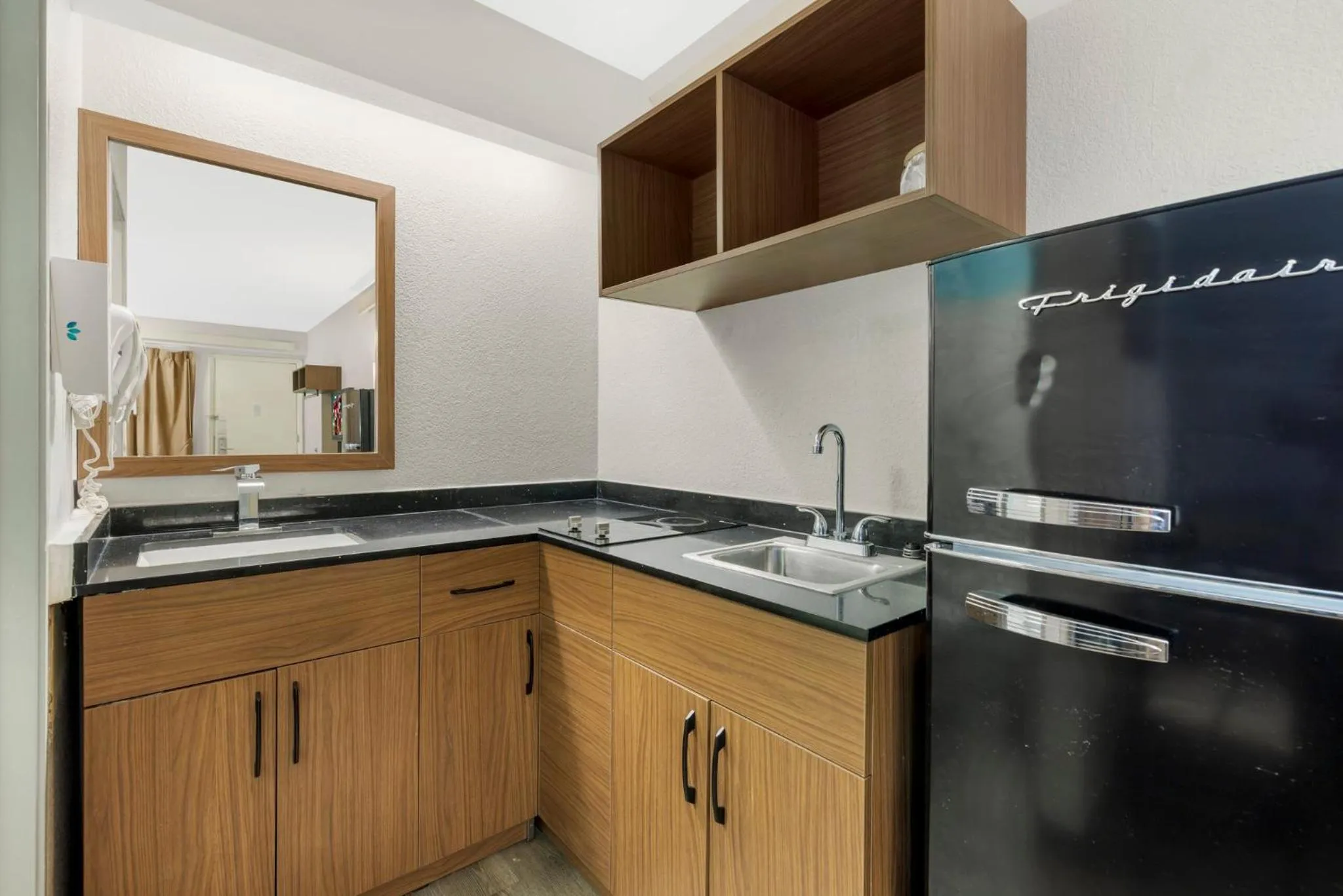 Photo of the whole room in HomeTowne Studios by Red Roof Buffalo - Niagara Airport