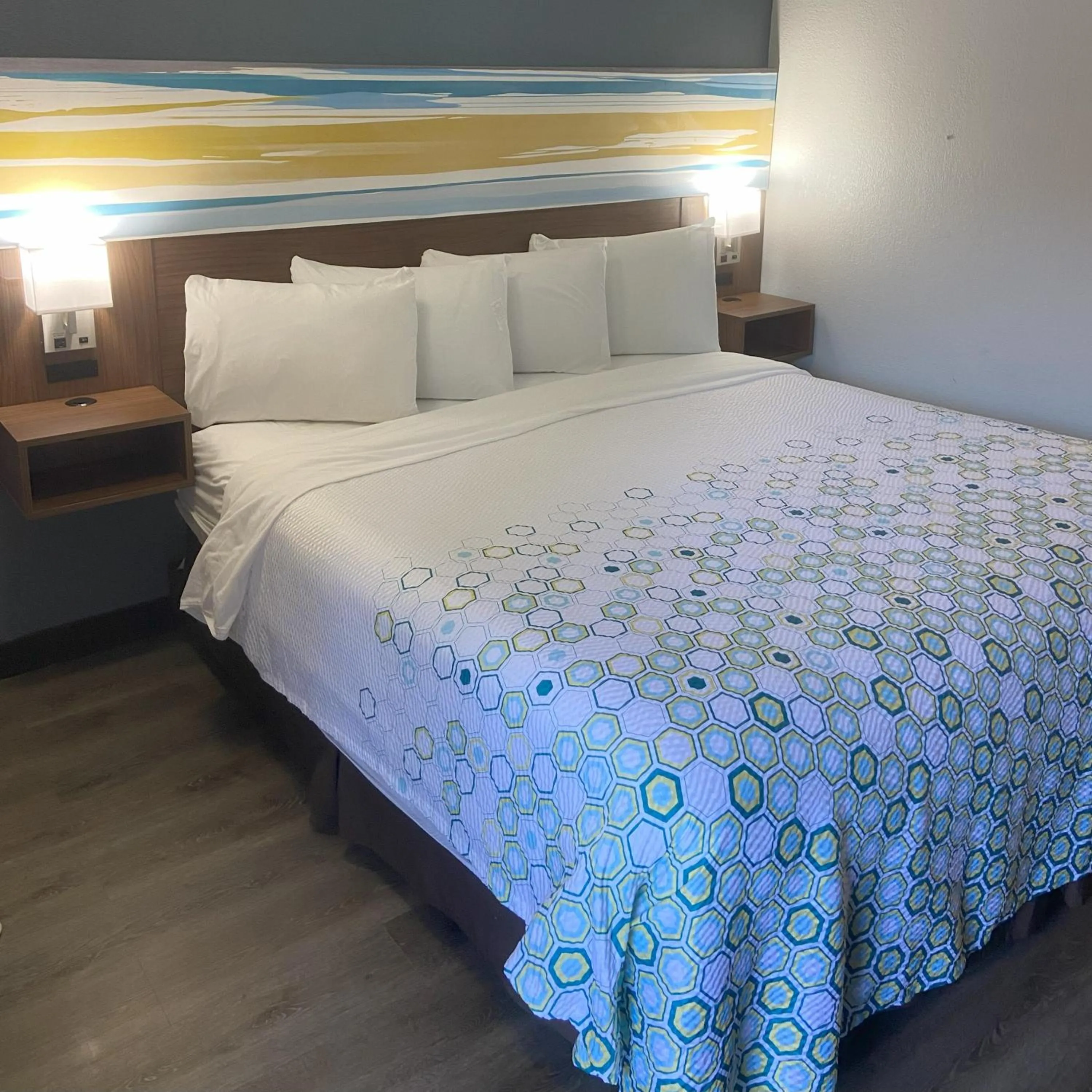 Bedroom, Bed in HomeTowne Studios by Red Roof Buffalo - Niagara Airport