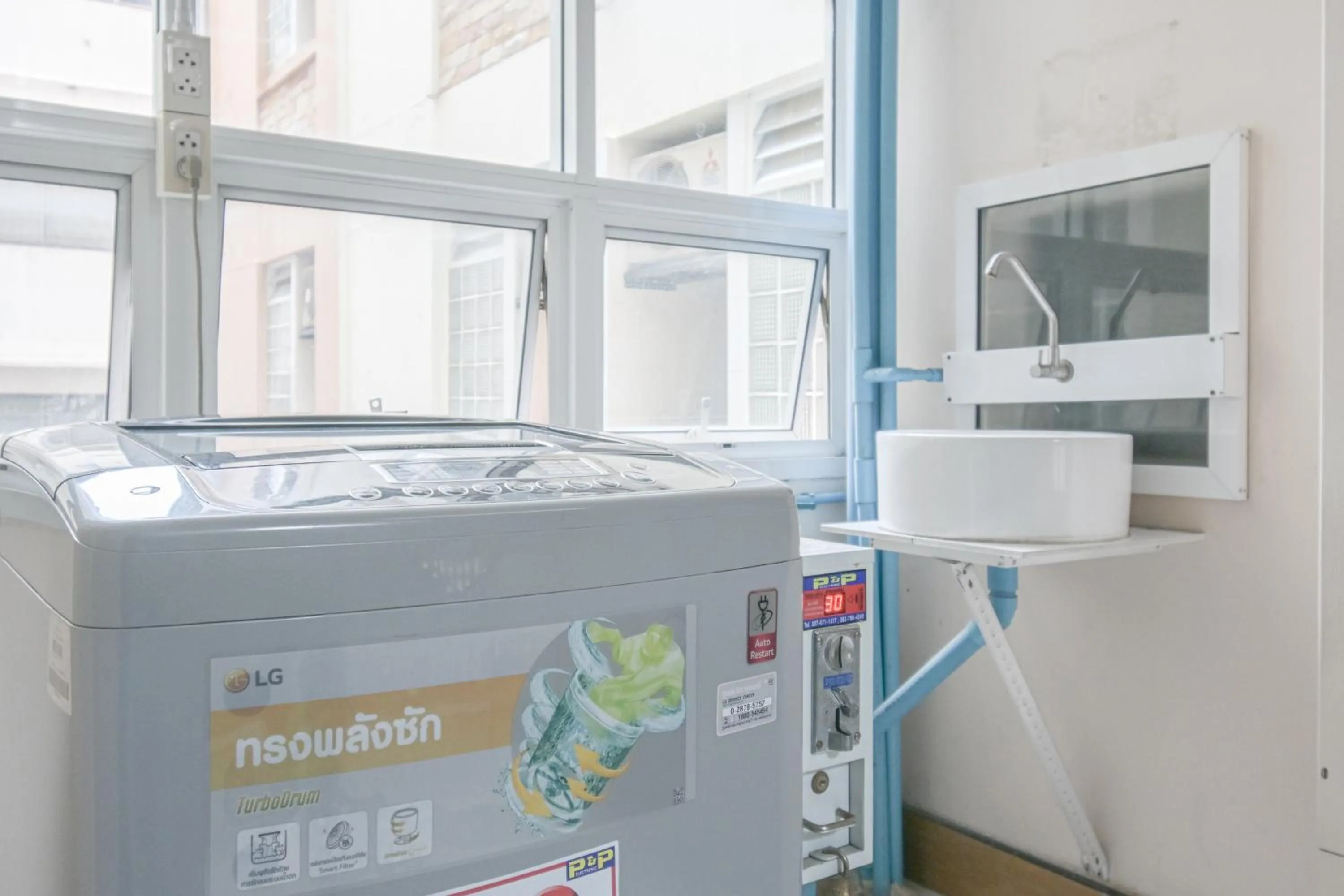 washing machine in AC Habitat Bangkok