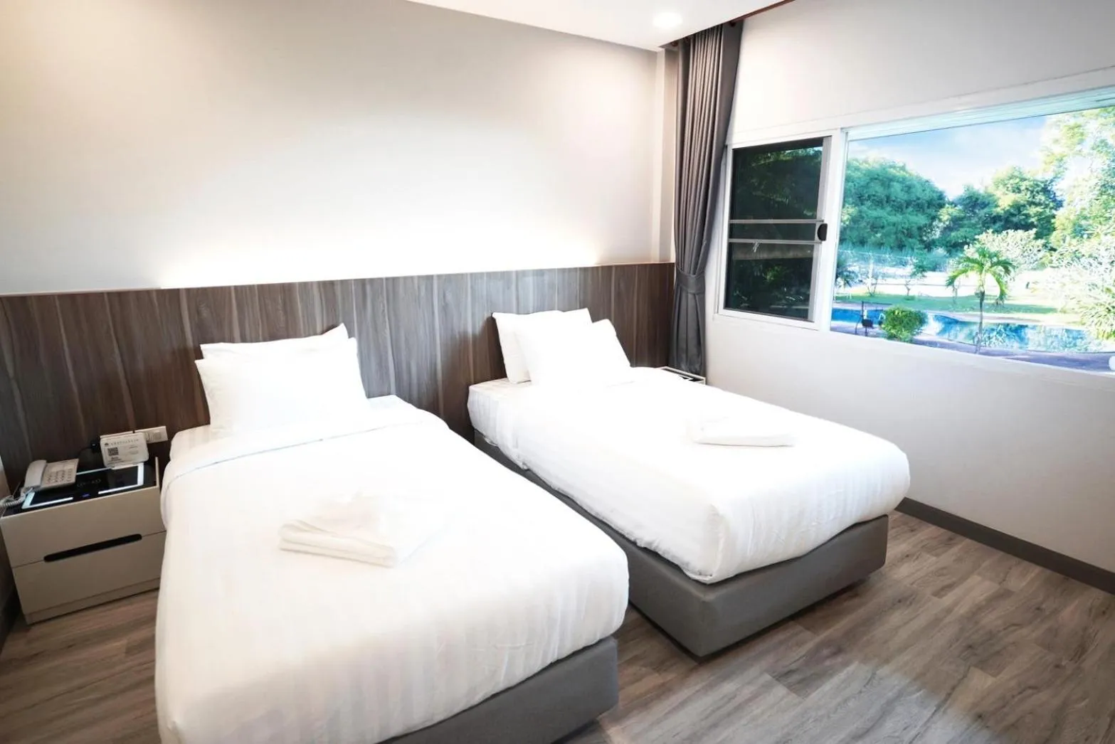 Bed in The Space Airport Hotel Chiang Rai