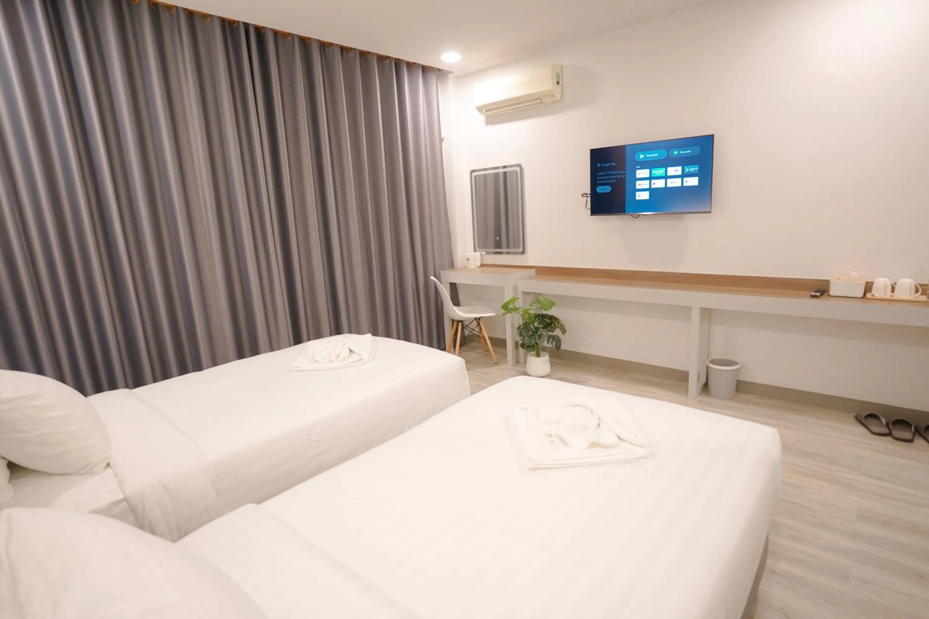 Bed in The Space Airport Hotel Chiang Rai