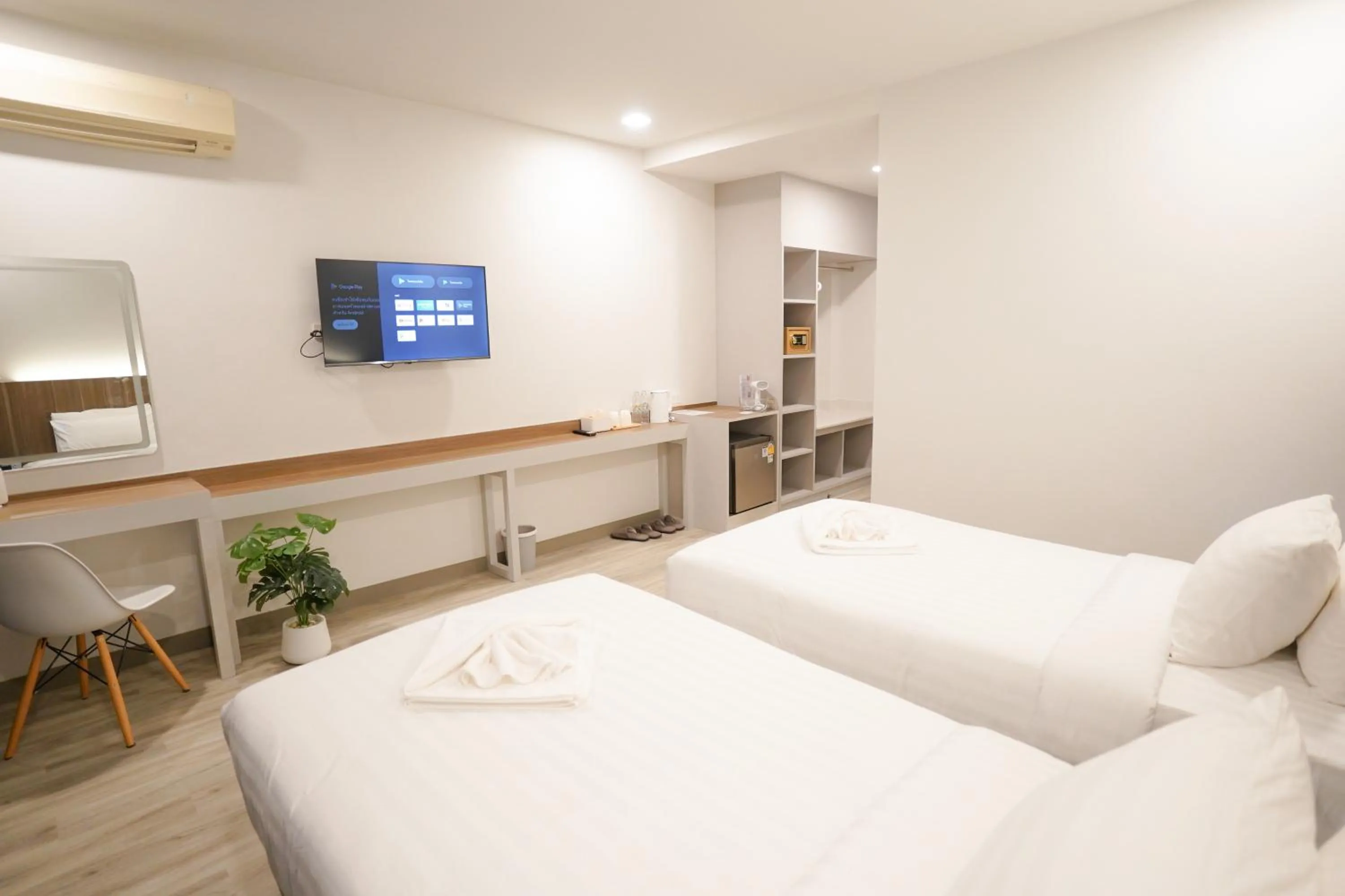 Bed in The Space Airport Hotel Chiang Rai