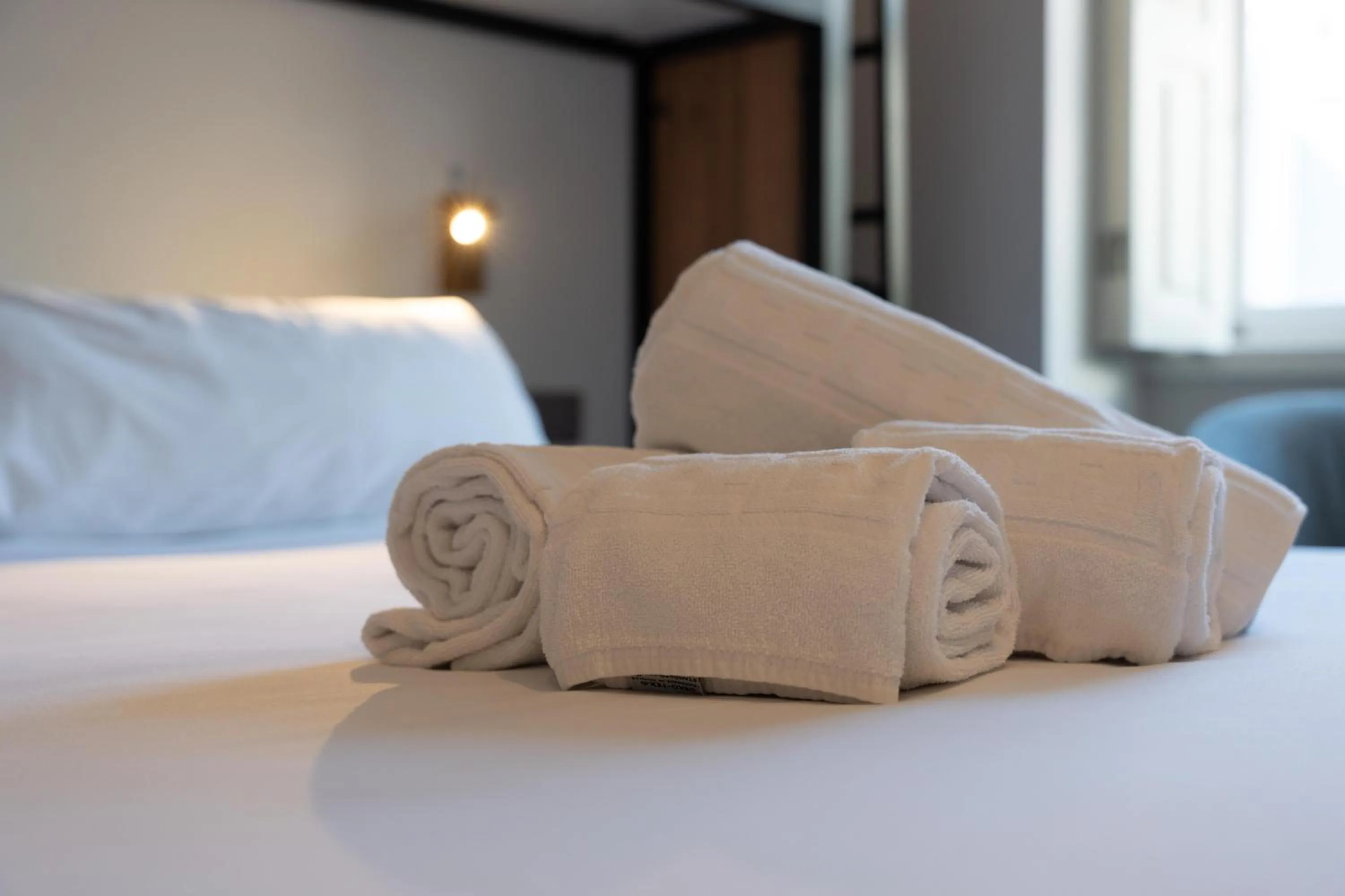 towels, Bed in The Central House Granada Elvira