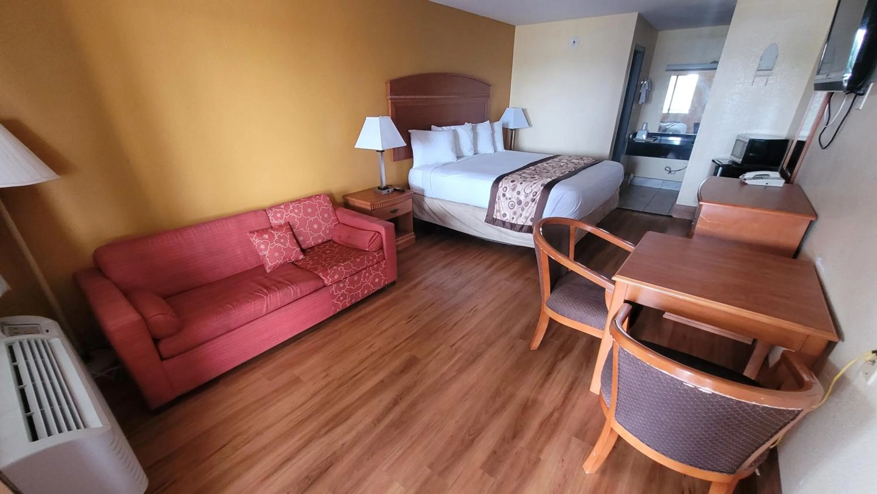 Bed in Americas Best Value Inn Frost Bank Center