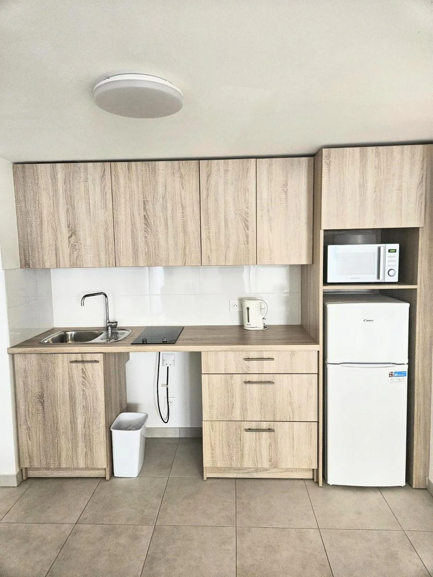 Kitchen or kitchenette in Zenao Appart'hôtels Villeneuve Loubet