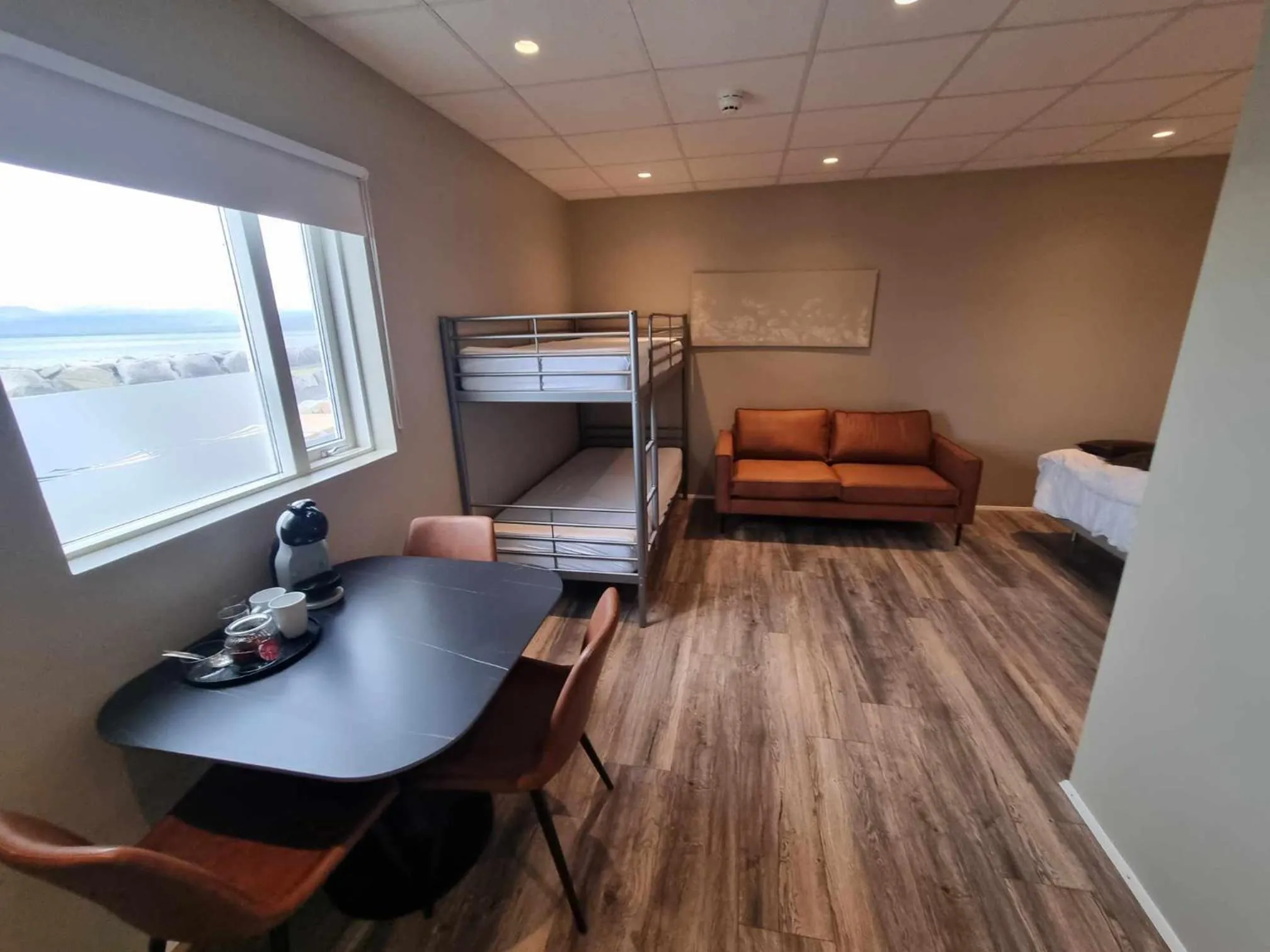 Seating area, Bed in Við Hafið Guesthouse