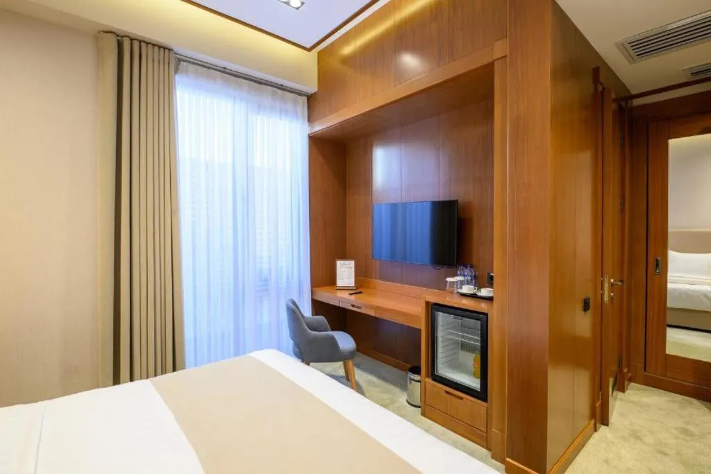 TV and multimedia, Bed in Consti Hotel Tashkent