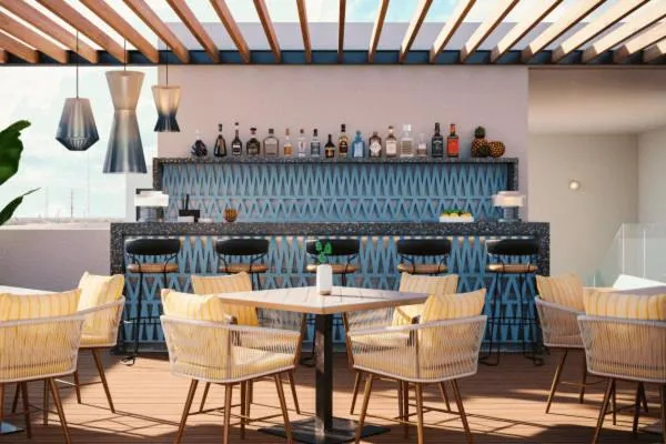 Lounge or bar in abba Suites Playa del Carmen