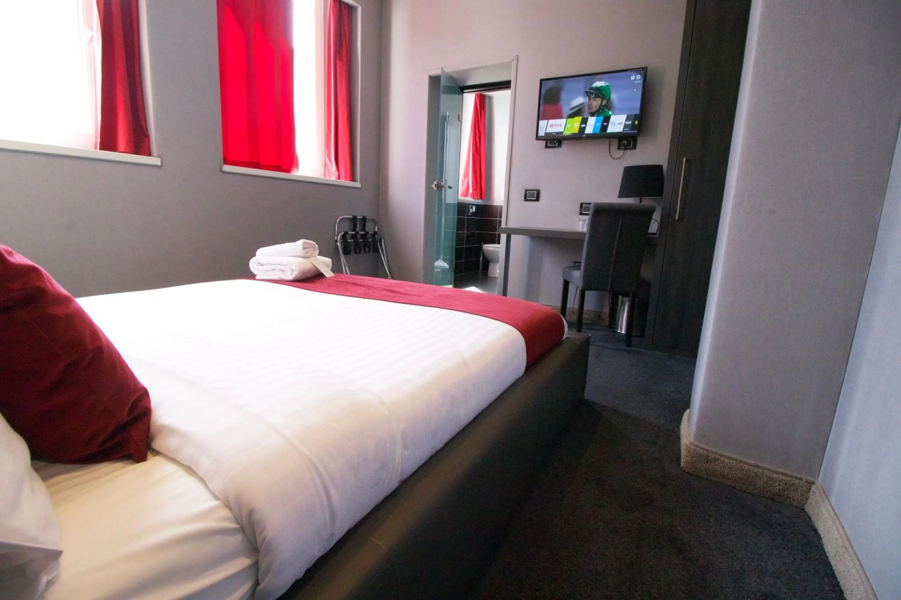 Bed in The Bryson Hotel