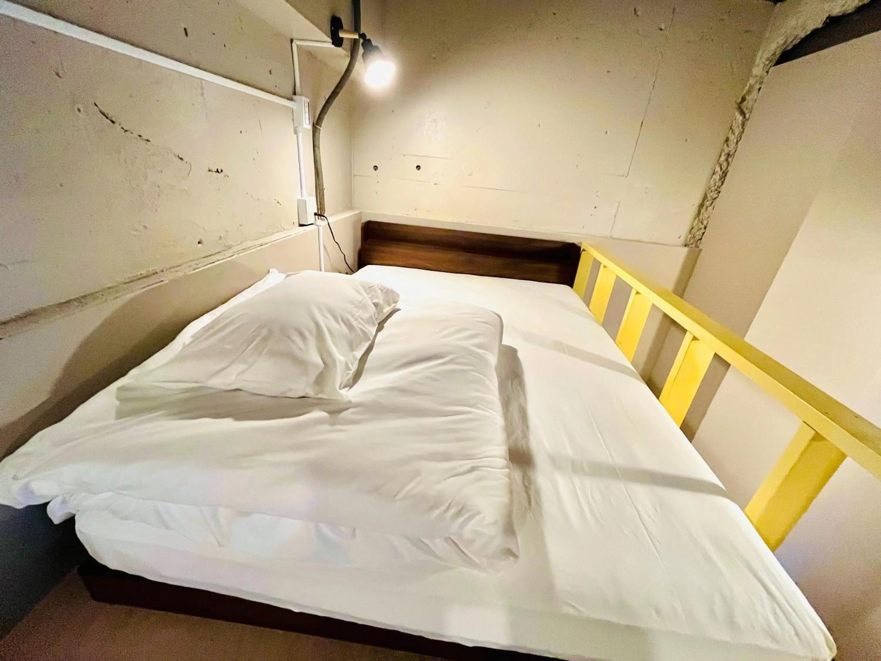 Bed in Hinode Kagurazakaekimae Hotel