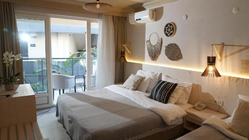Bedroom, Bed in En Vie Beach Boutique Hotel - Adults Only