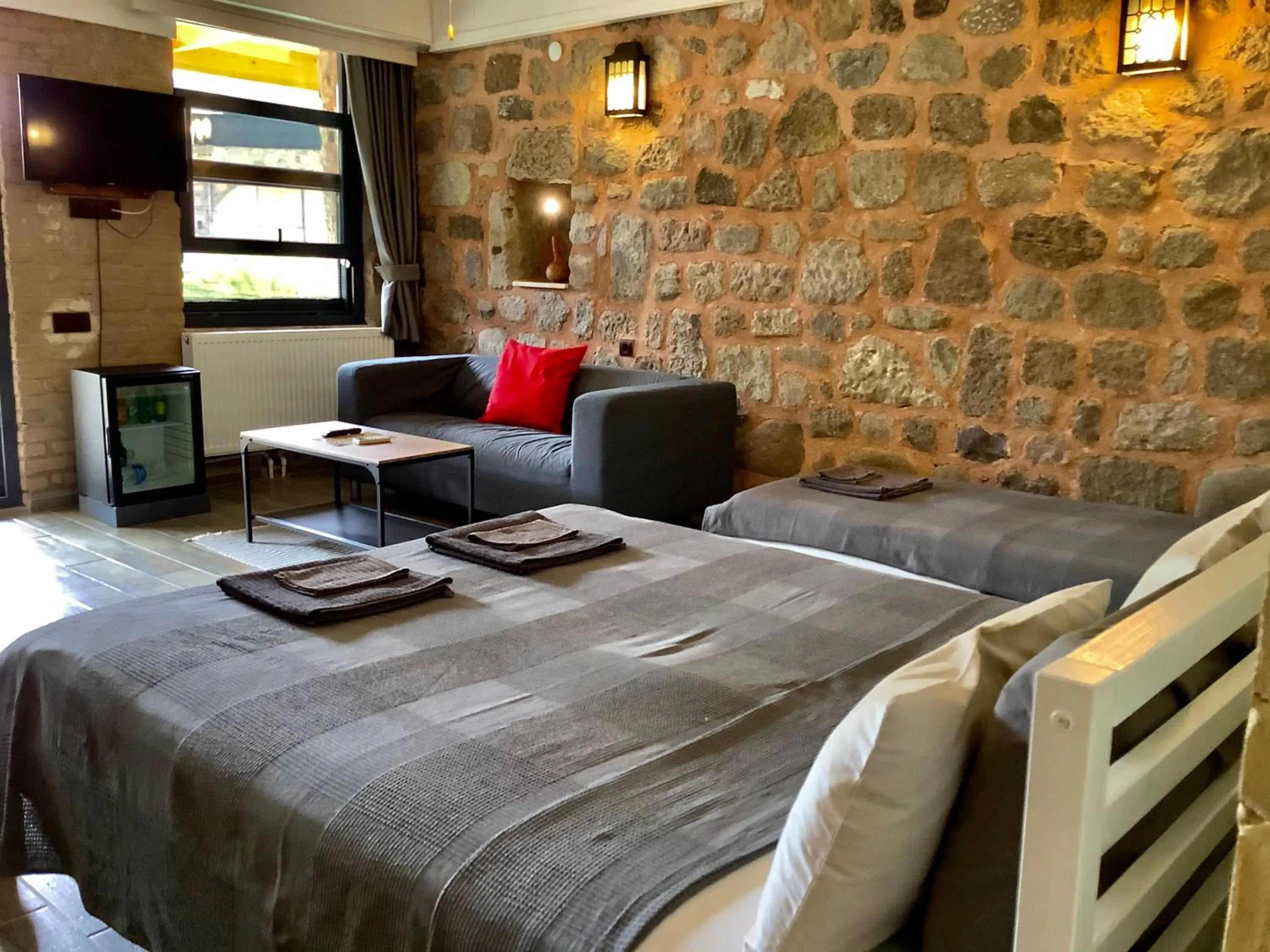 Bed in Attalos Suites Hotel