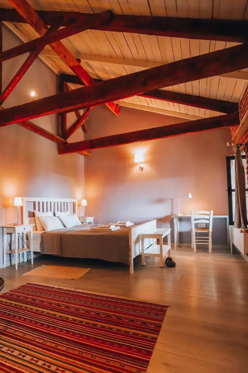 Bed in Attalos Suites Hotel