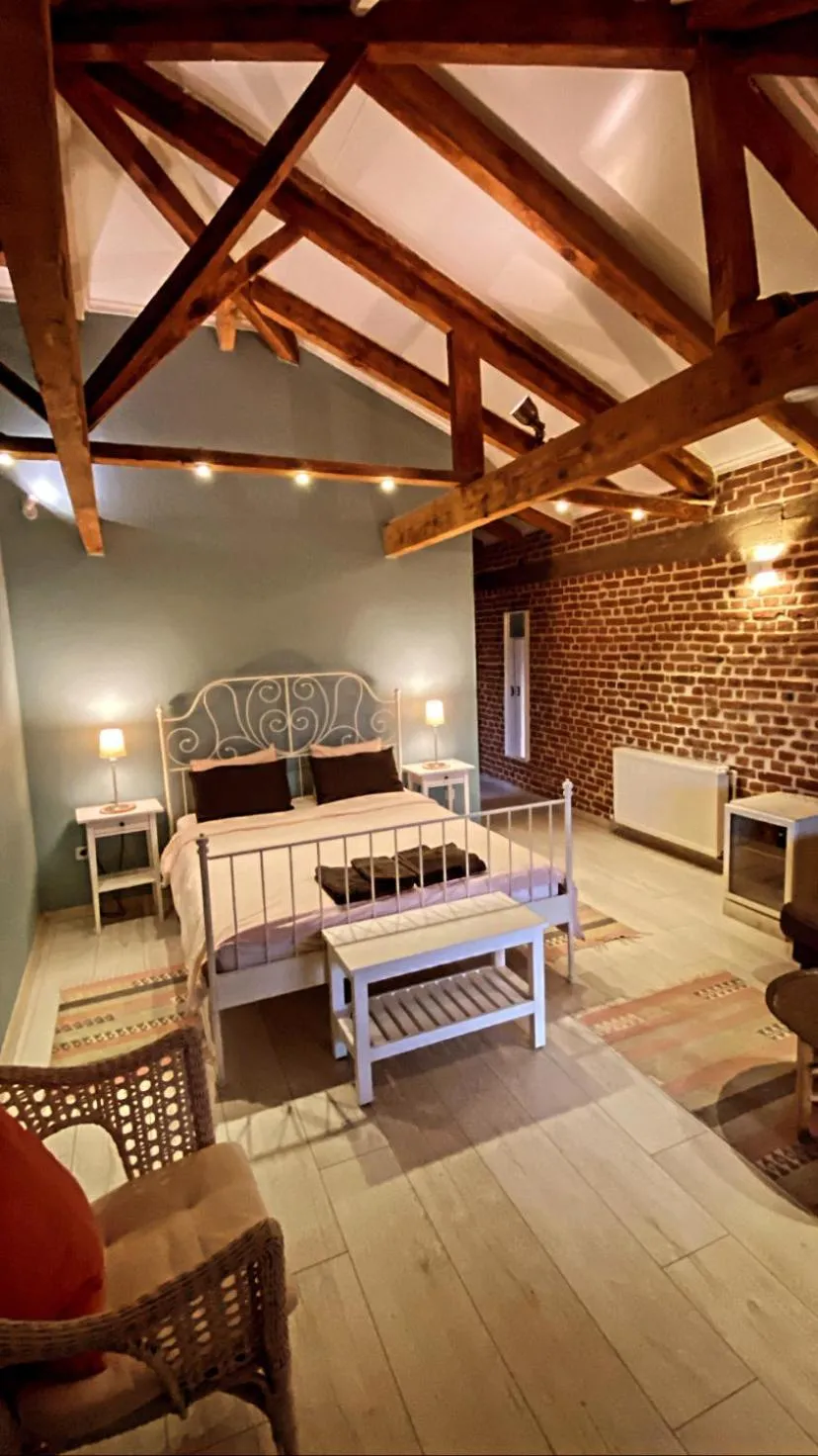 Bed in Attalos Suites Hotel