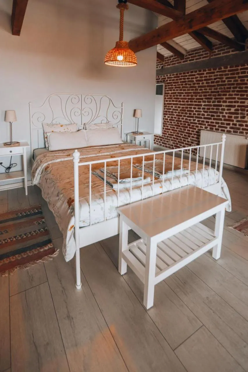 Bed in Attalos Suites Hotel