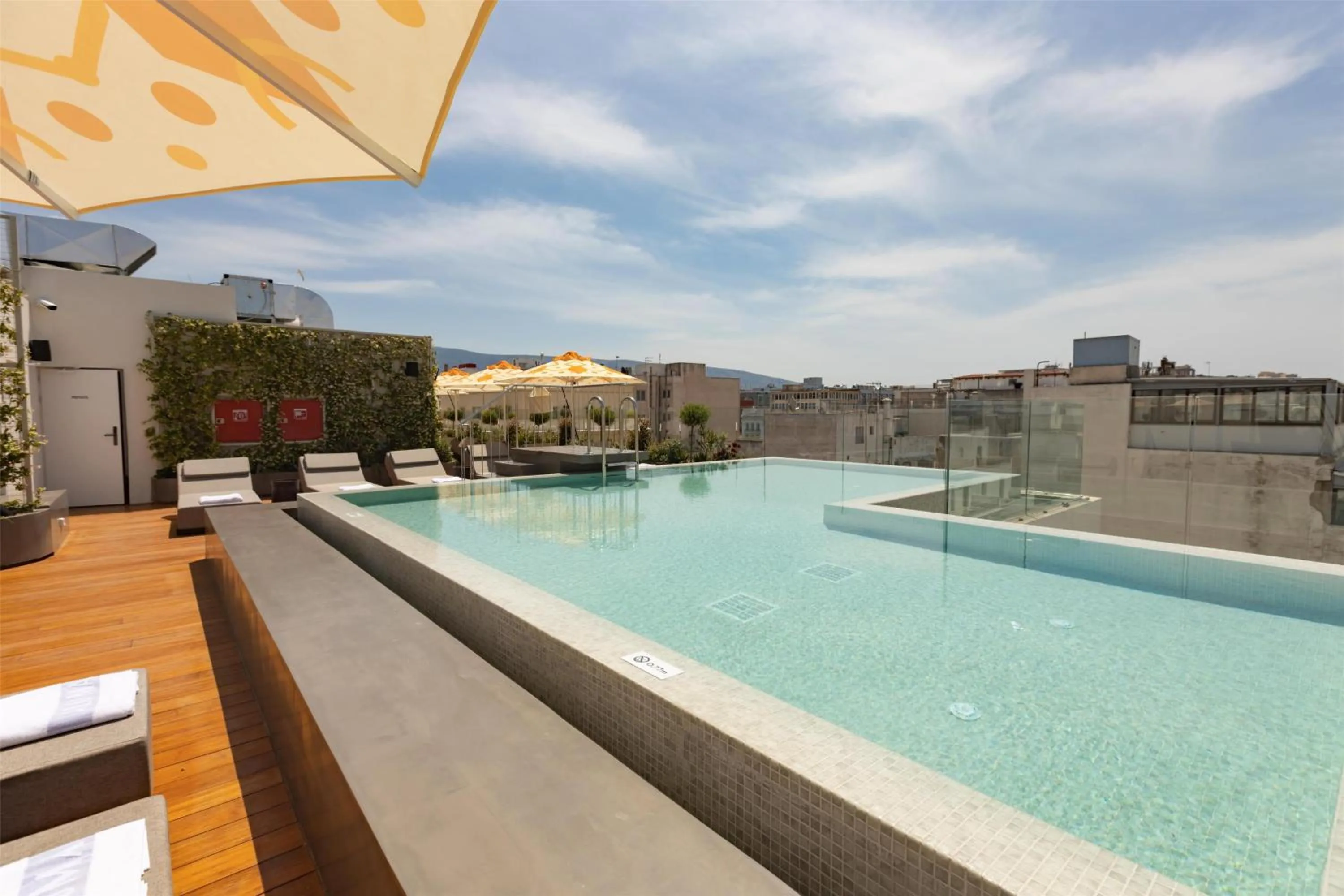 Pool view in Adia Aluma Athens, Curio Collection By Hilton