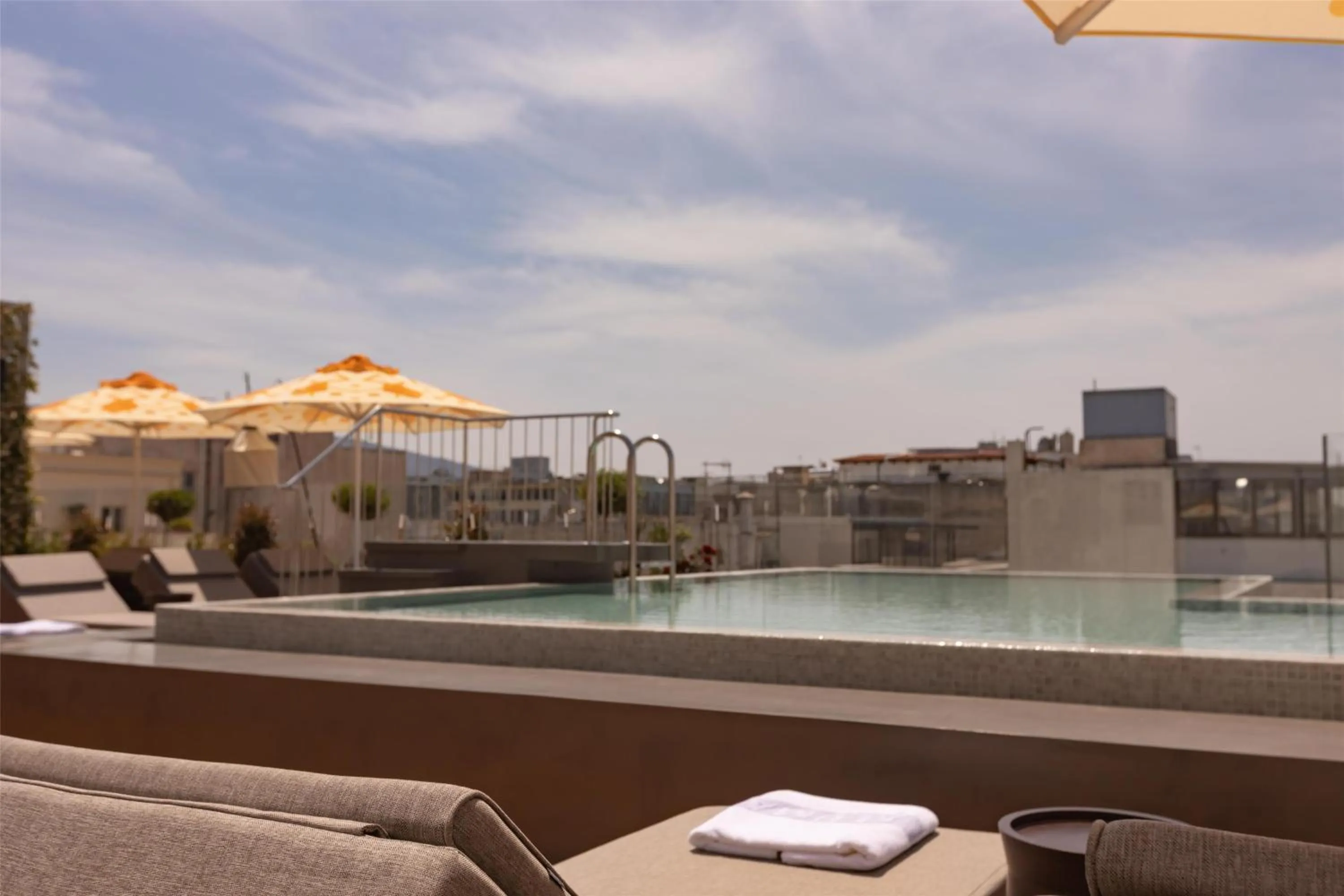 Pool view in Adia Aluma Athens, Curio Collection By Hilton