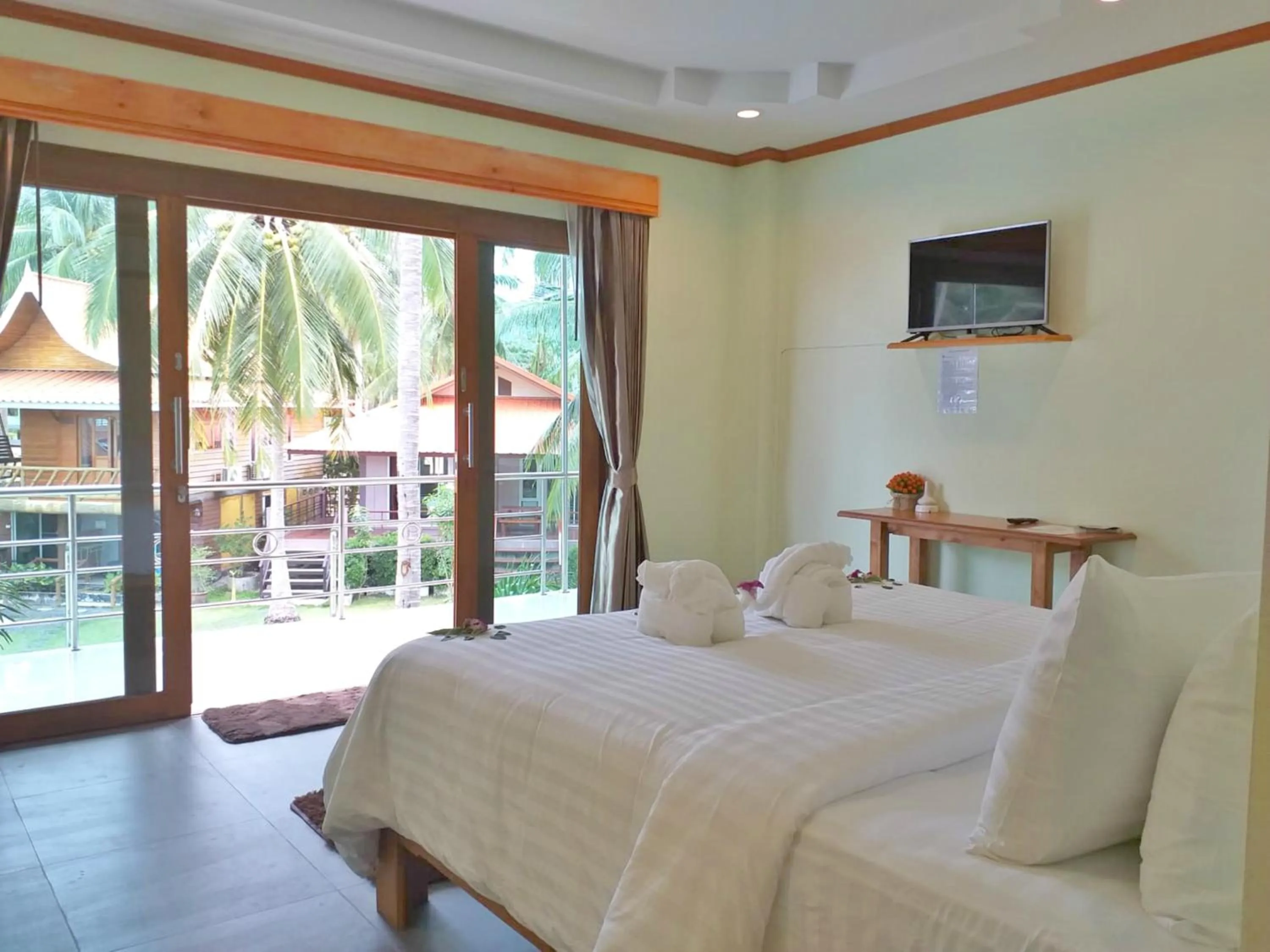 Garden view, Bed in The Ford SunSet Beach Resort