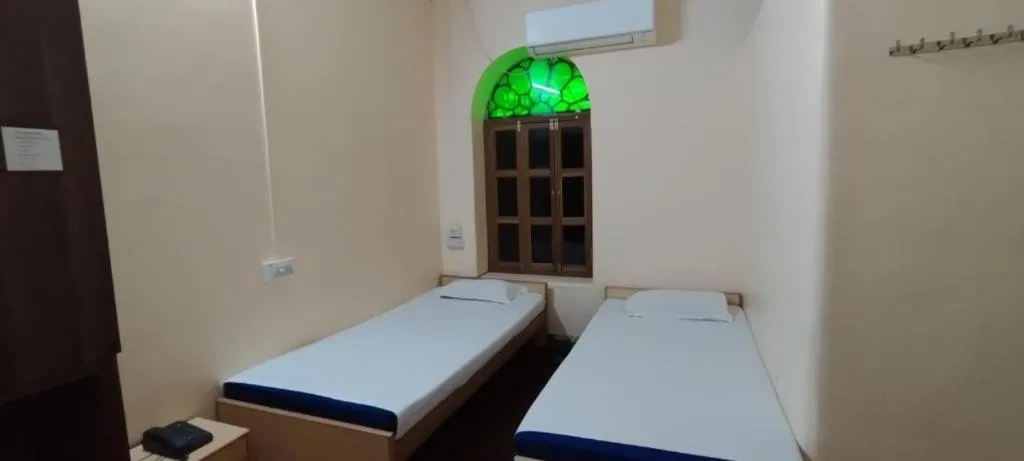 Bed in Shaw Guest House