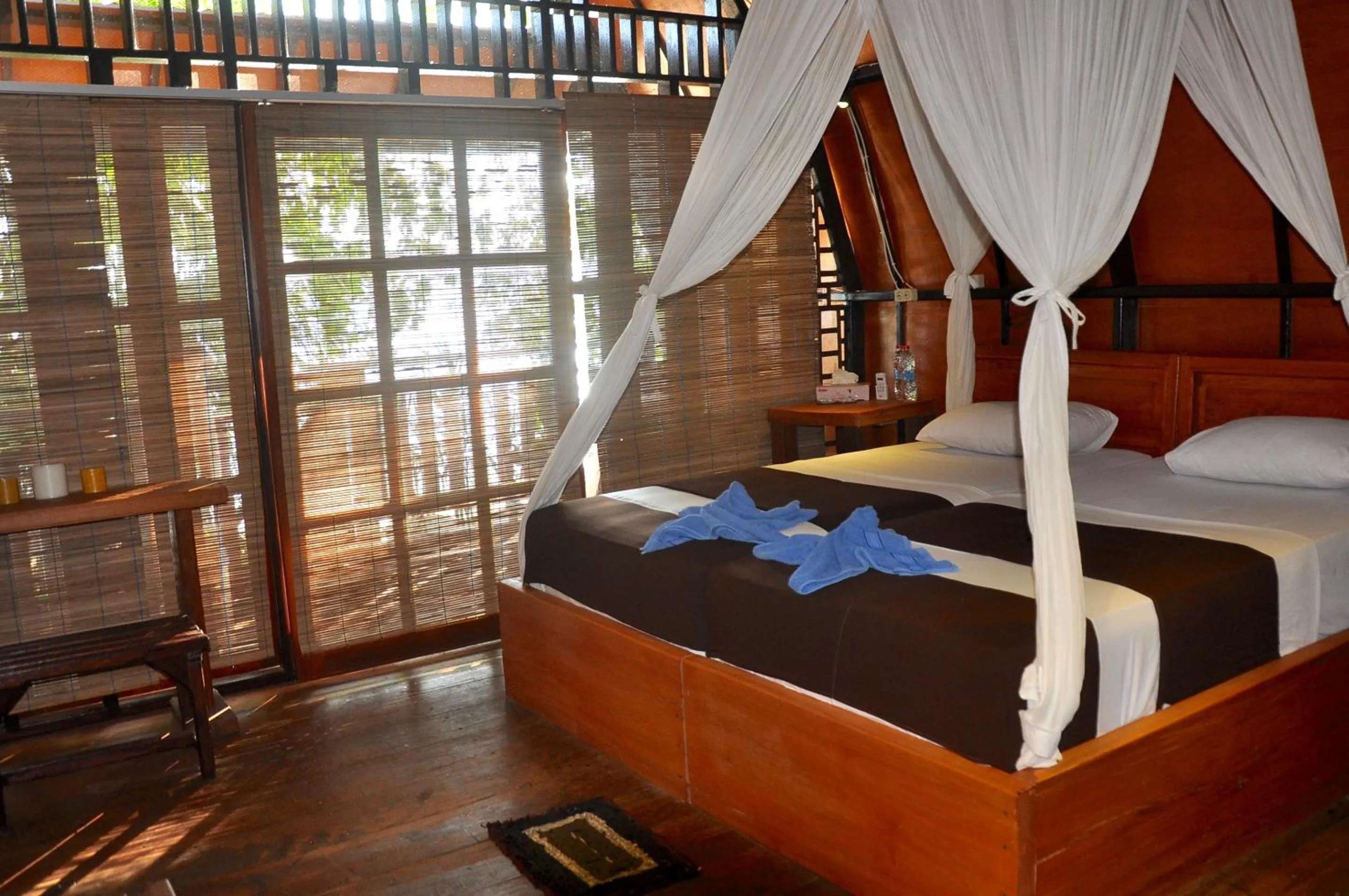 Photo of the whole room, Bed in Raja Ampat Dive Resort