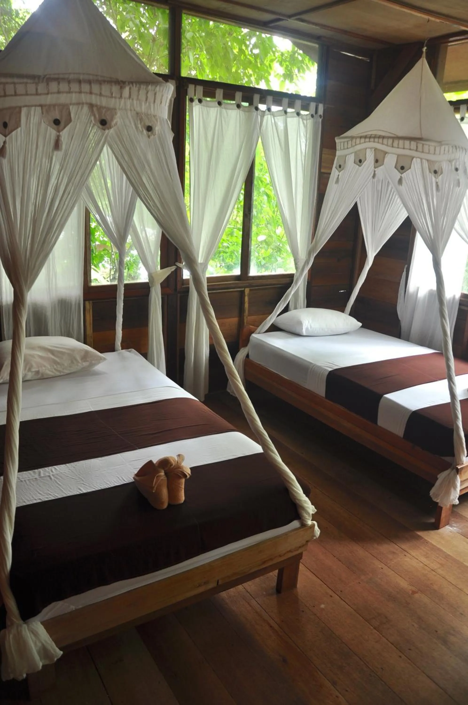 Property building, Bed in Raja Ampat Dive Resort