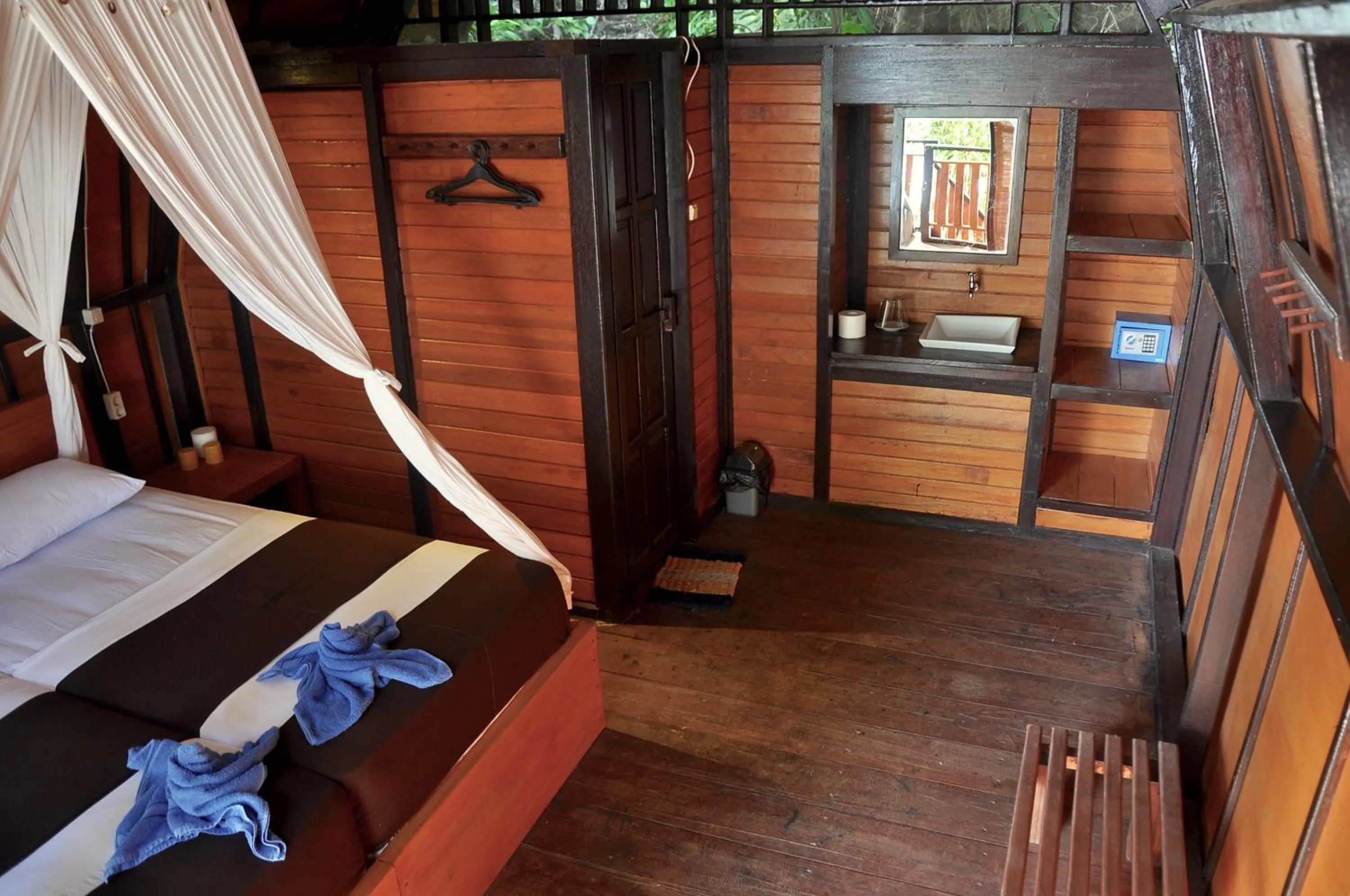 Photo of the whole room, Bed in Raja Ampat Dive Resort