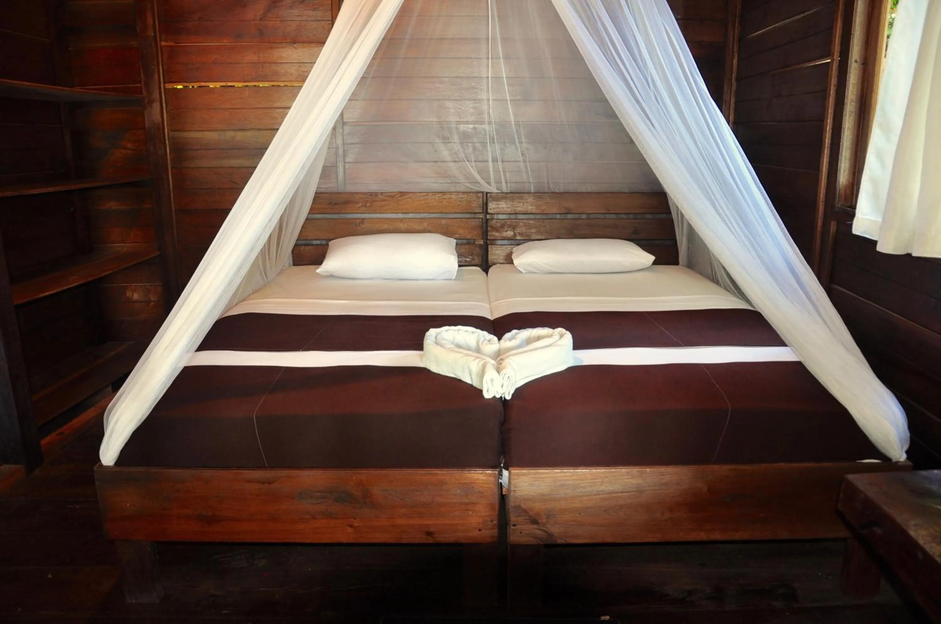 Bed in Raja Ampat Dive Resort