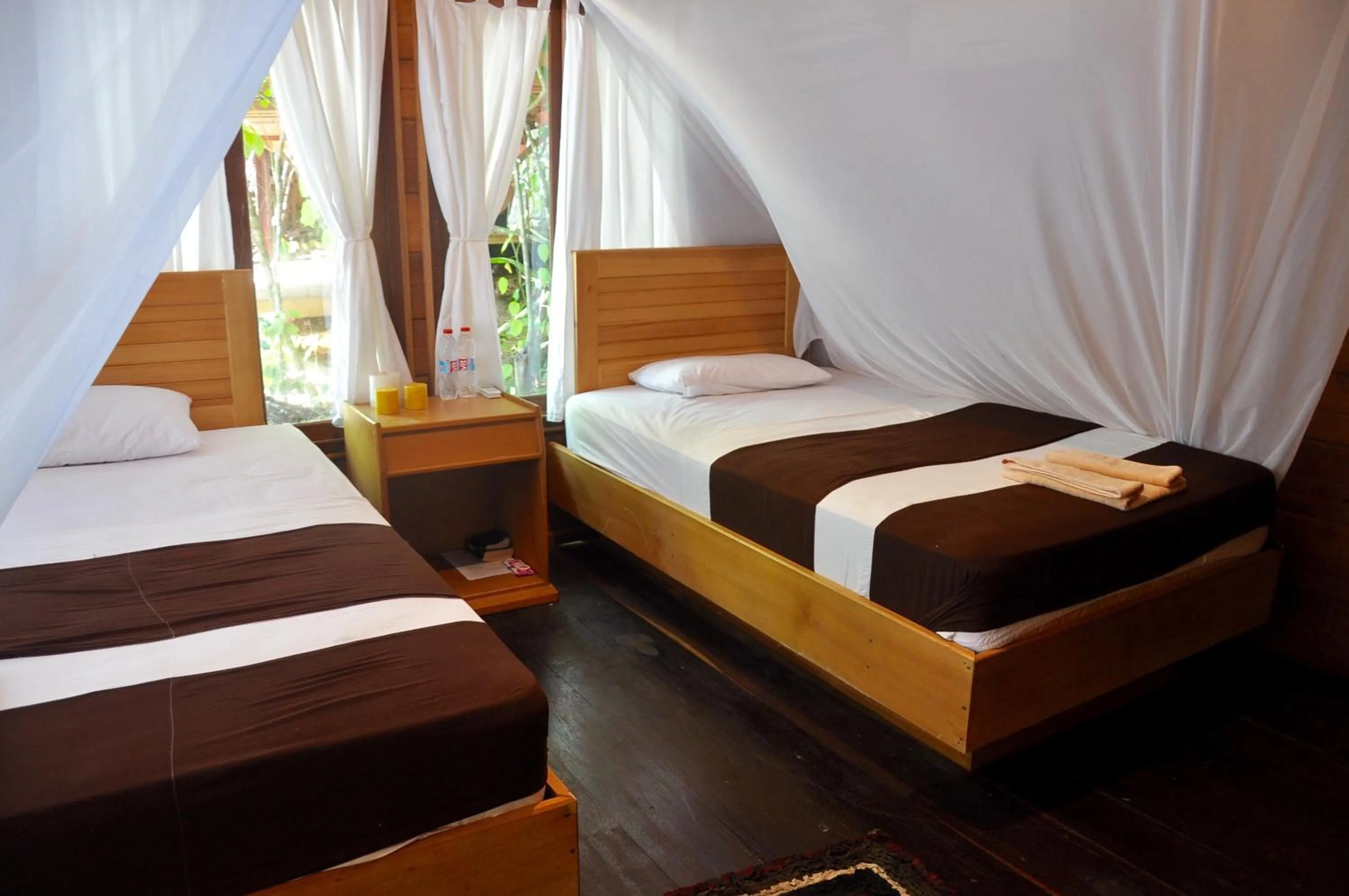 Property building, Bed in Raja Ampat Dive Resort