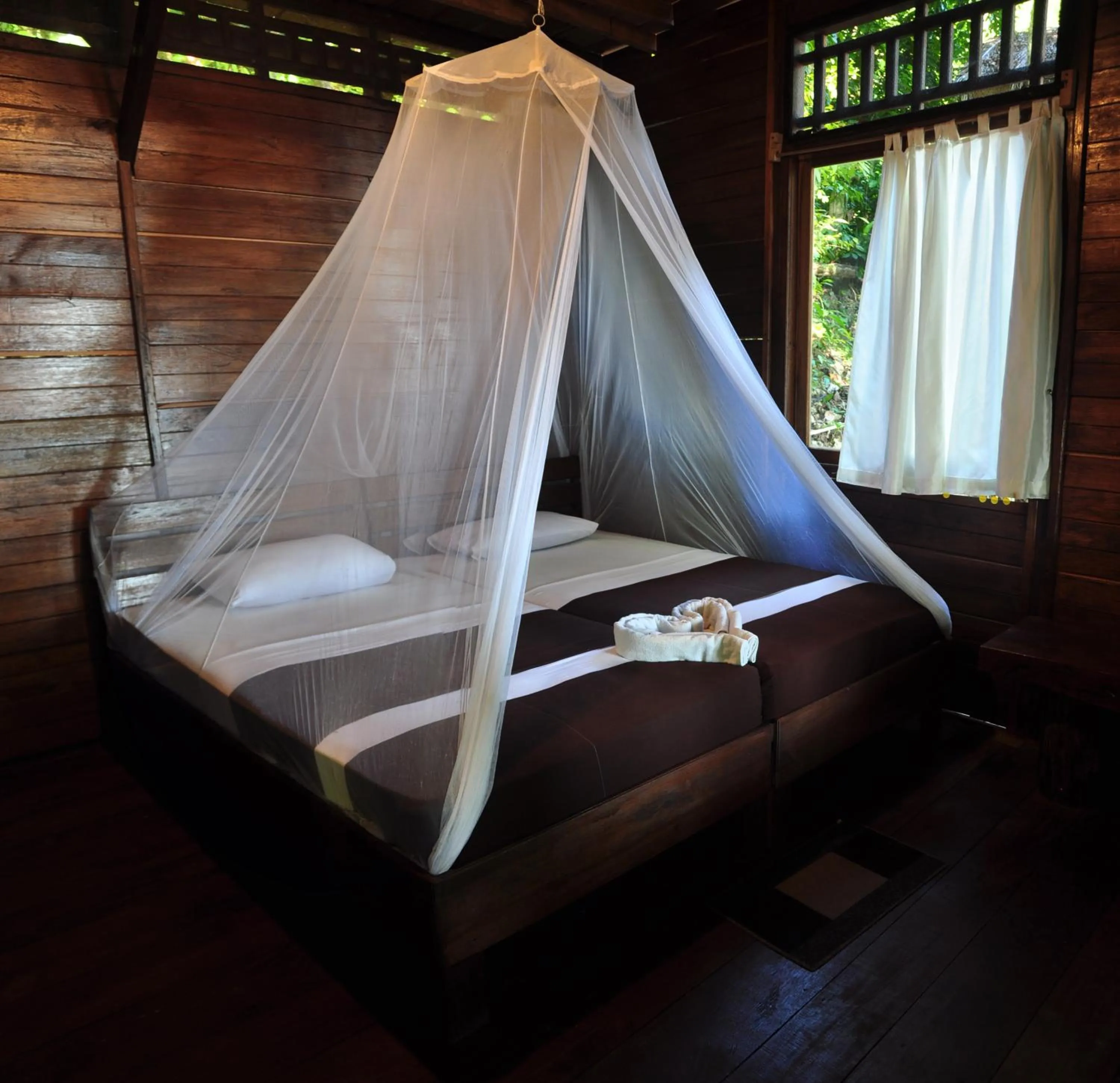 Property building, Bed in Raja Ampat Dive Resort
