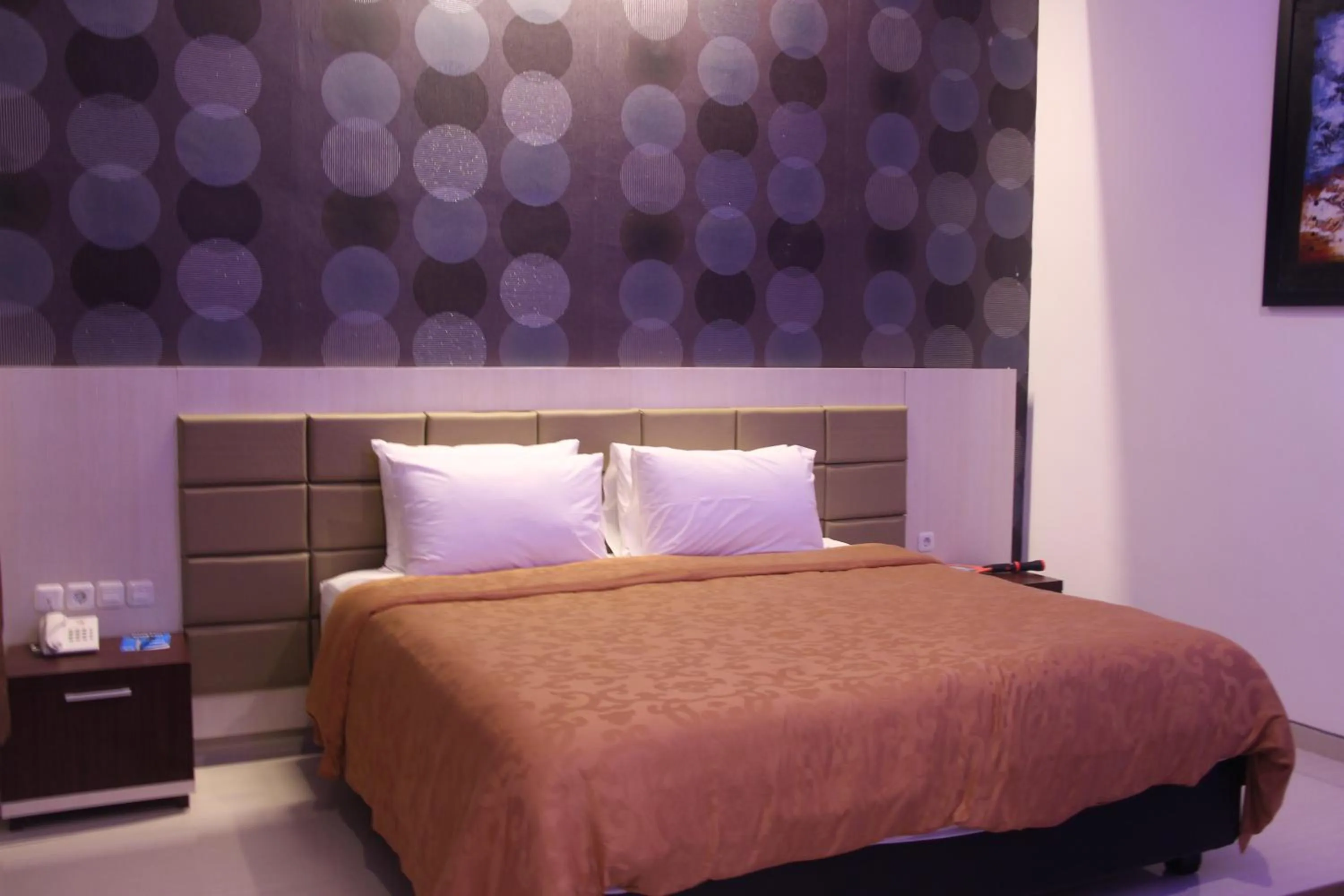 Bed in Tlogomas Guest House