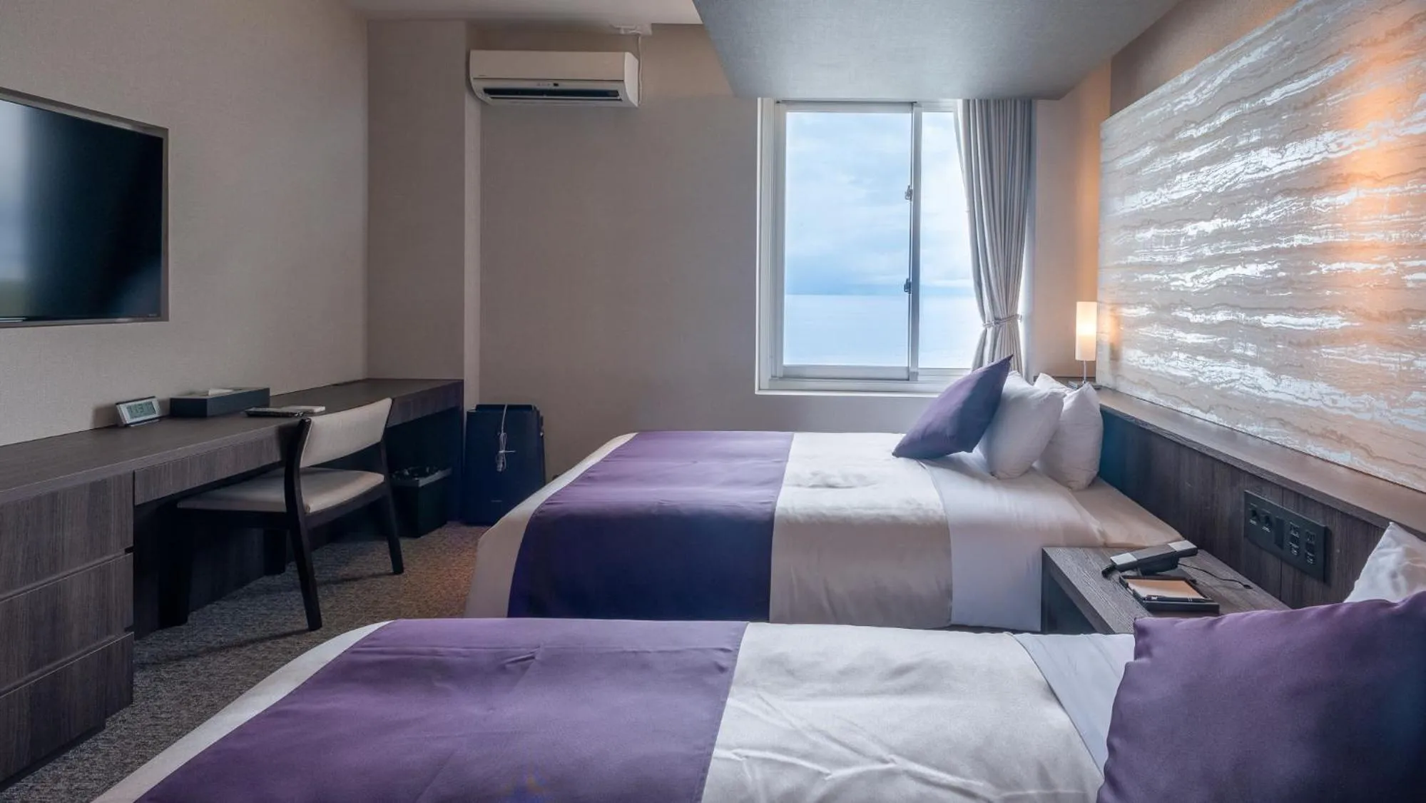 Bed in THE HOTEL YAKUSHIMA ocean & forest