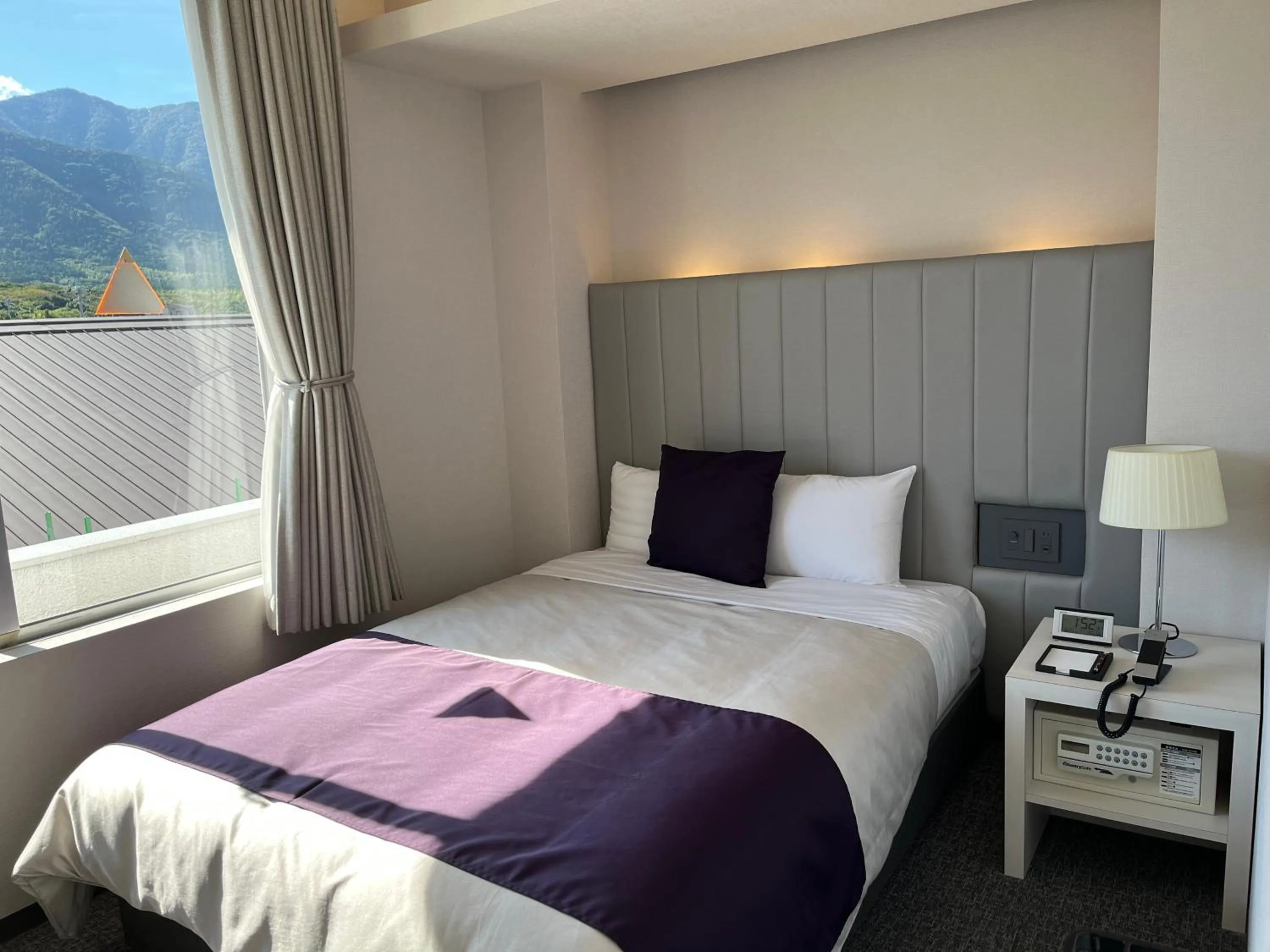 Bed in THE HOTEL YAKUSHIMA ocean & forest