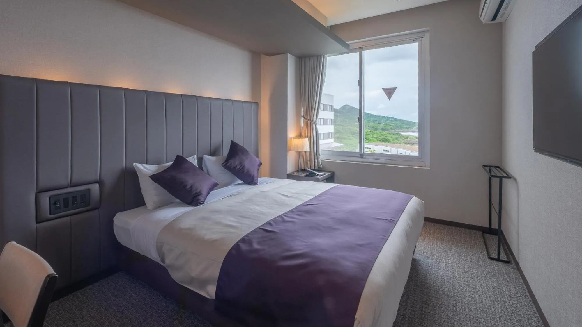 Bed in THE HOTEL YAKUSHIMA ocean & forest