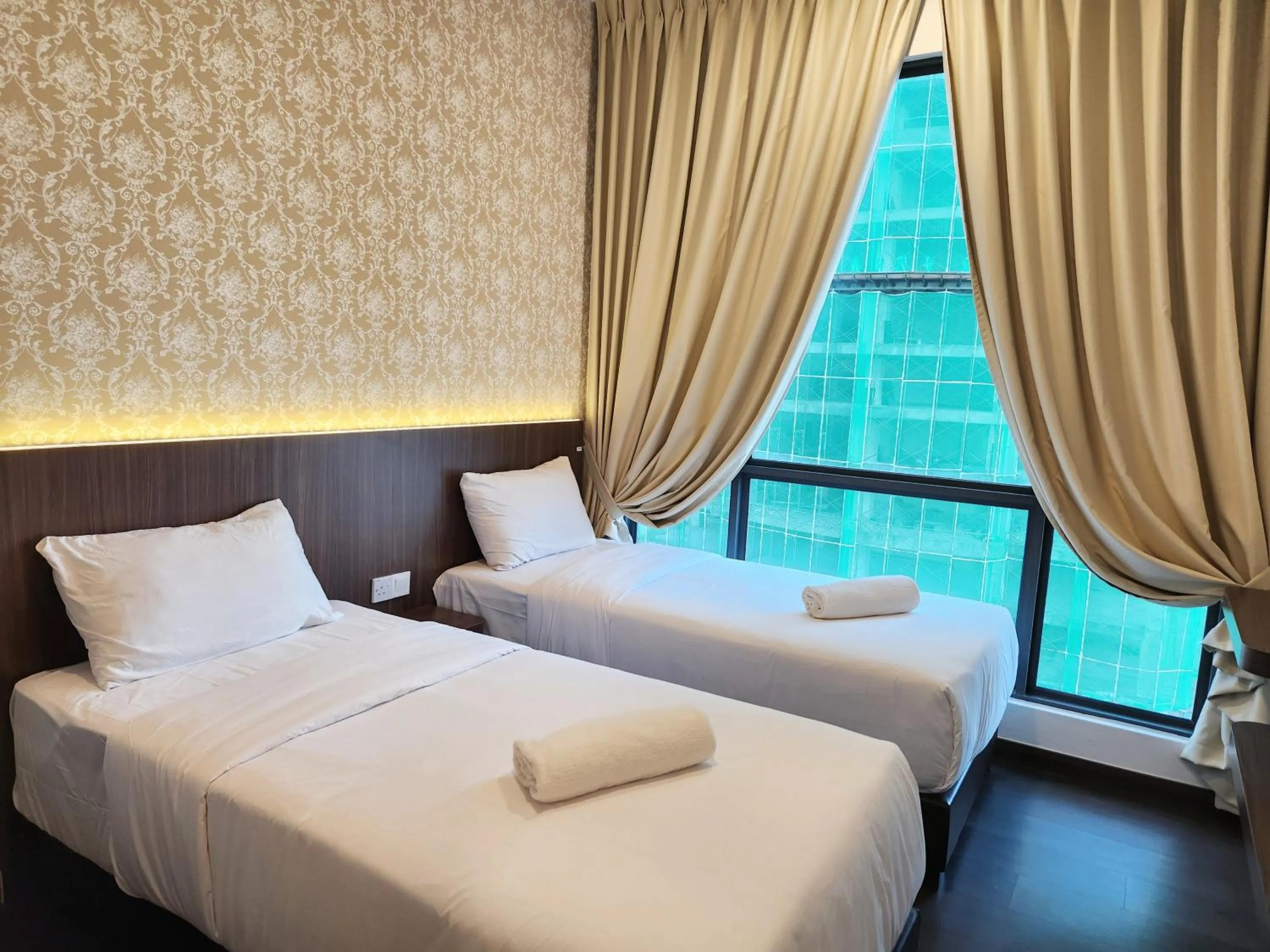 Bed in SKS Pavillion Suites