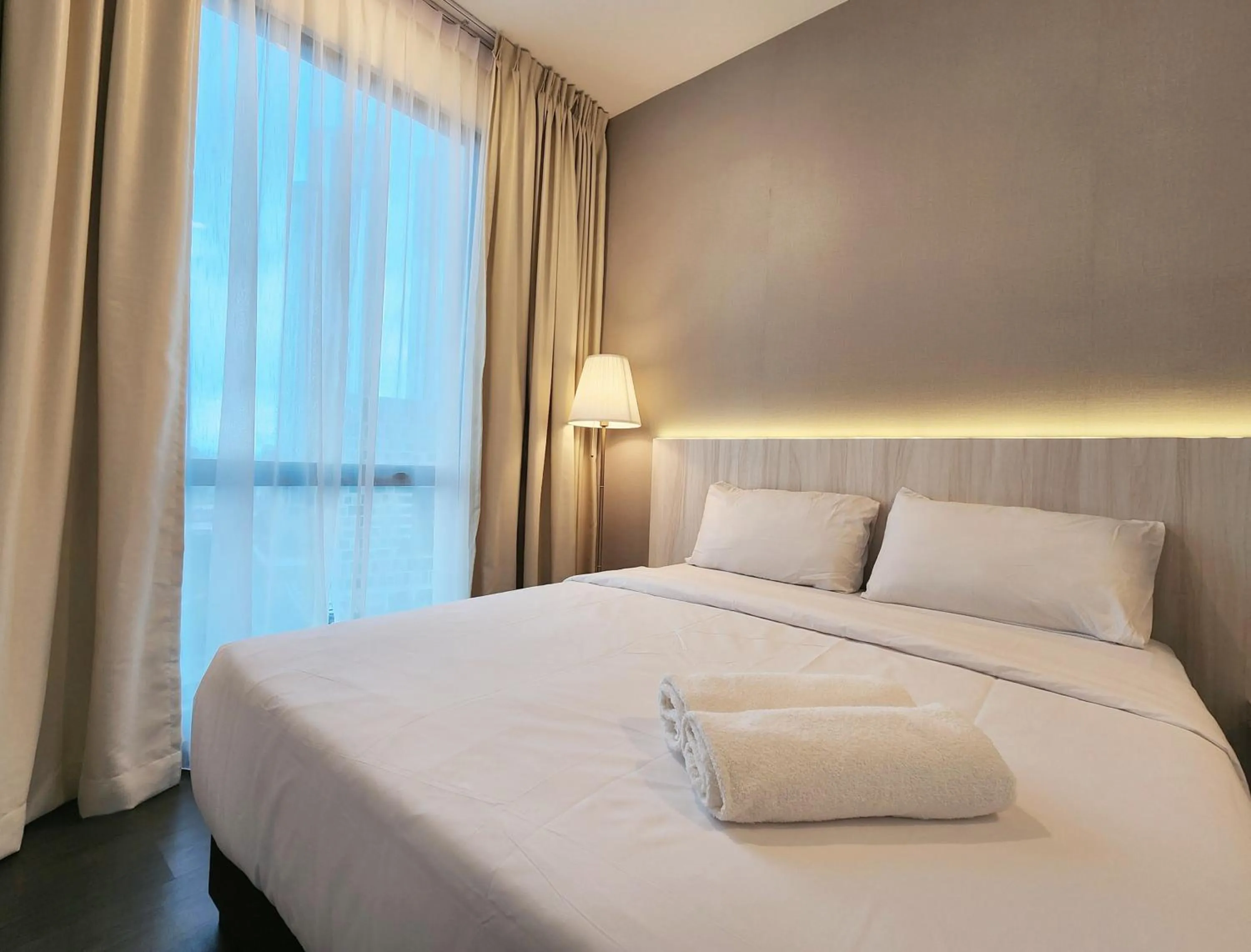 Bed in SKS Pavillion Suites