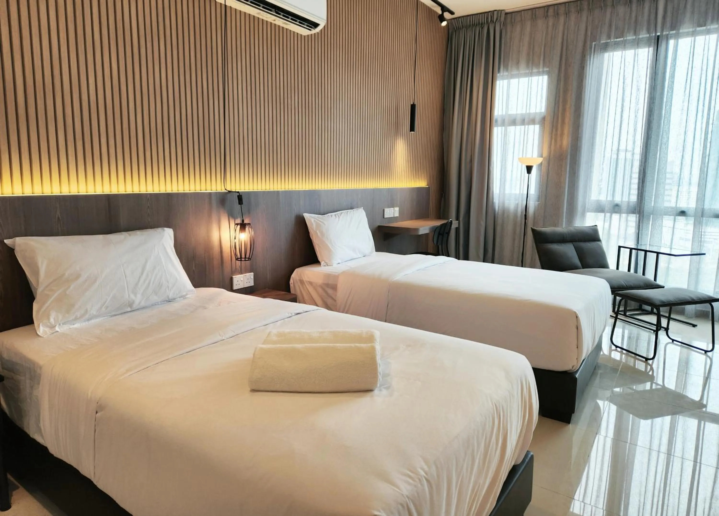 Bed in SKS Pavillion Suites