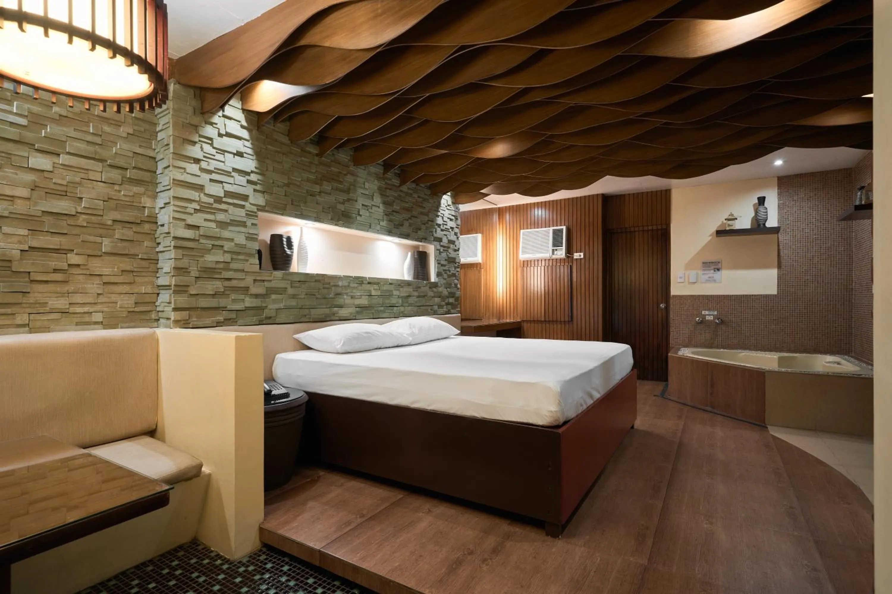 Bed in Victoria Court Suites - Pasig