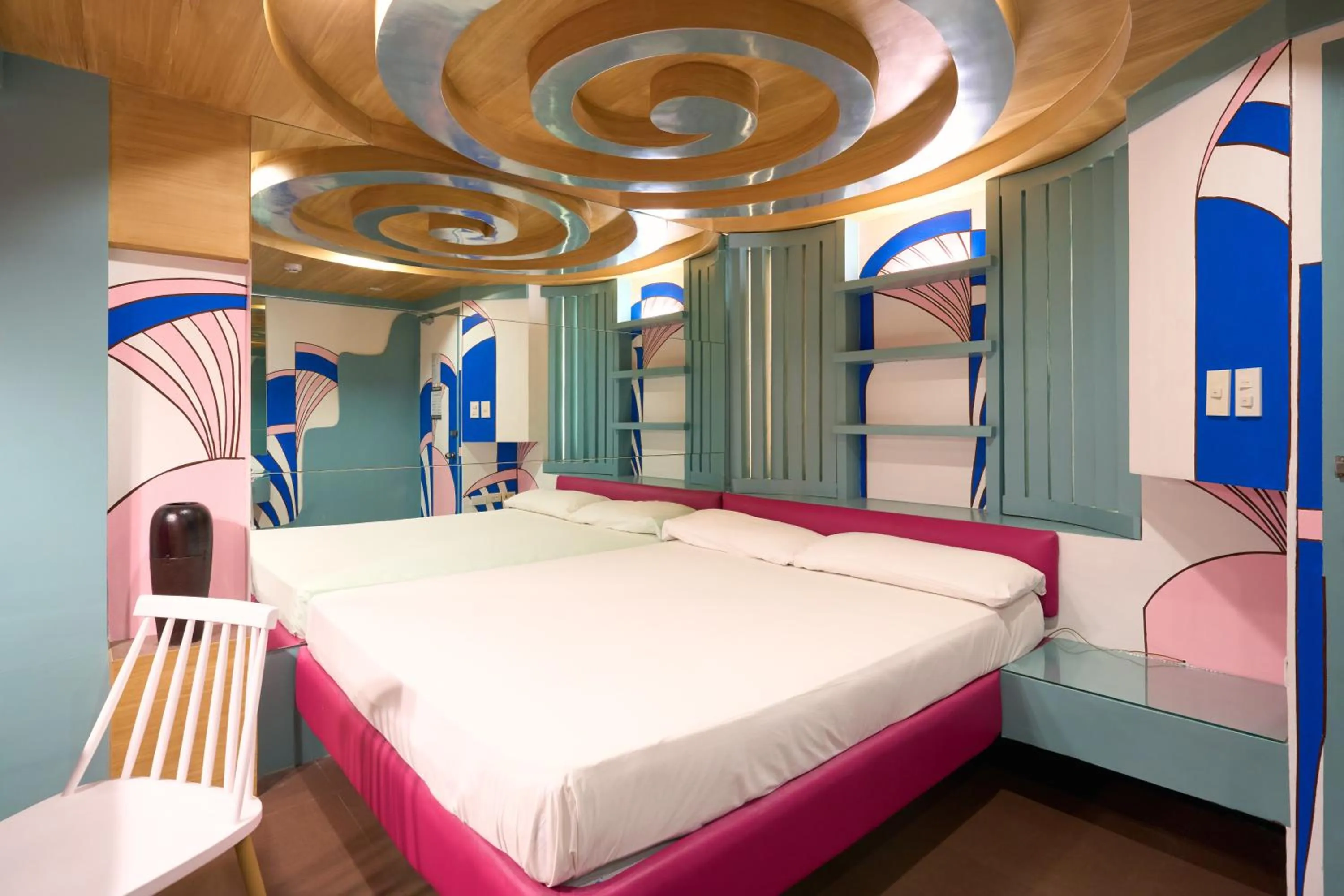 Photo of the whole room, Bed in Victoria Court Las Pinas