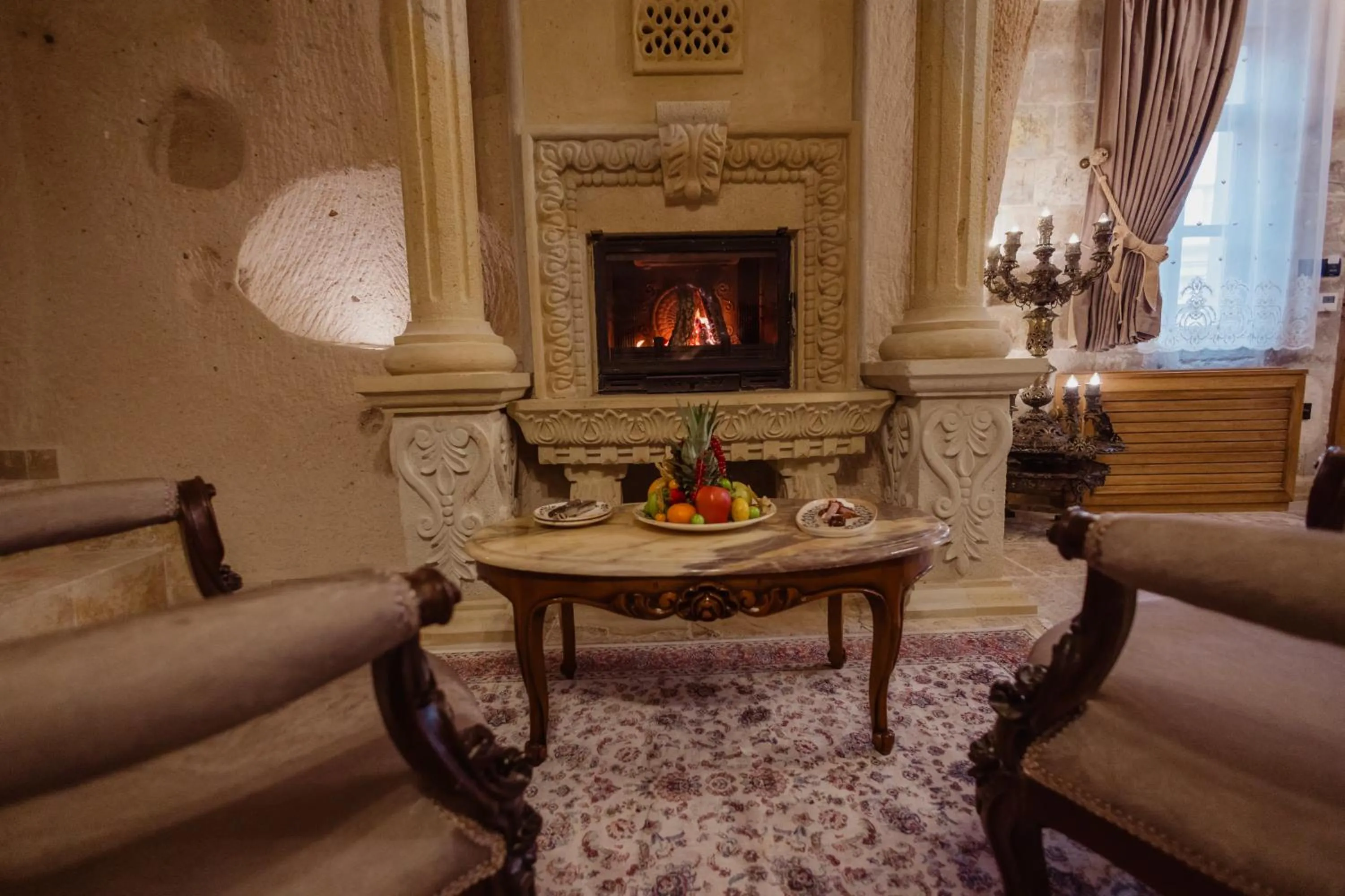 fireplace in The Kingdom Of Cappadocia Luxury Cave Hotel