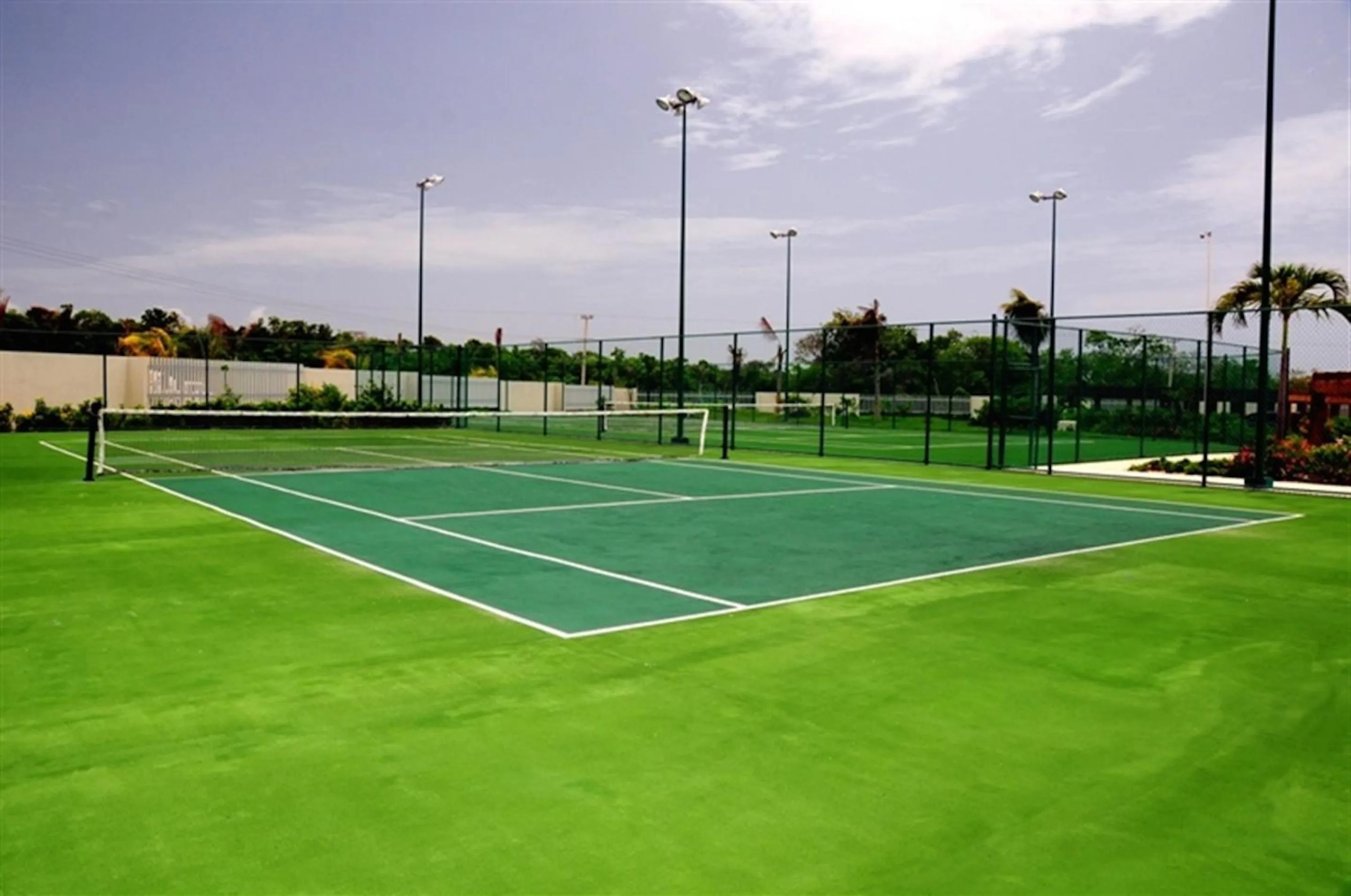 Tennis court in Luxury Condos at Mareazul Beachfront Complex with Resort-Style Amenities