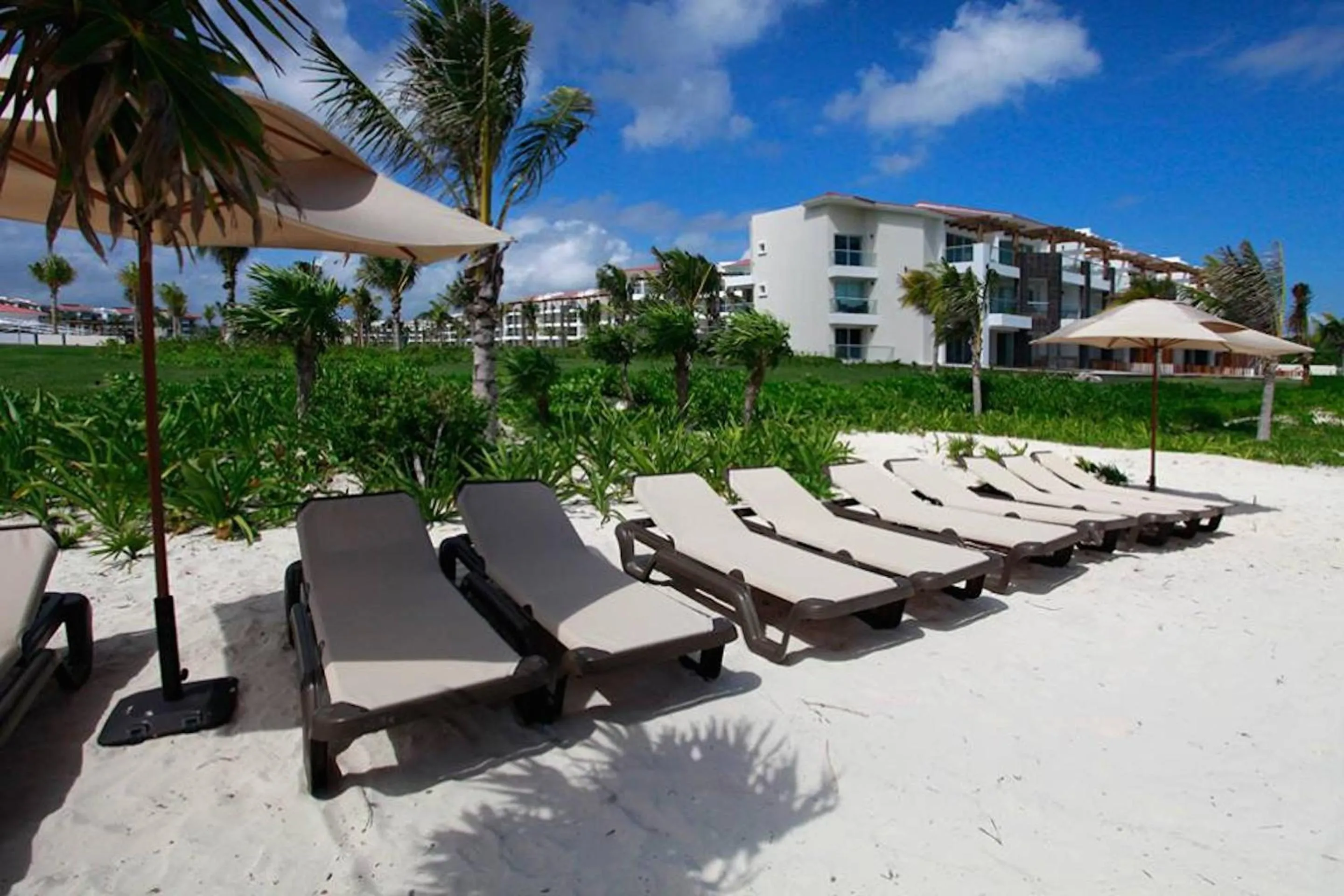 Beach in Luxury Condos at Mareazul Beachfront Complex with Resort-Style Amenities
