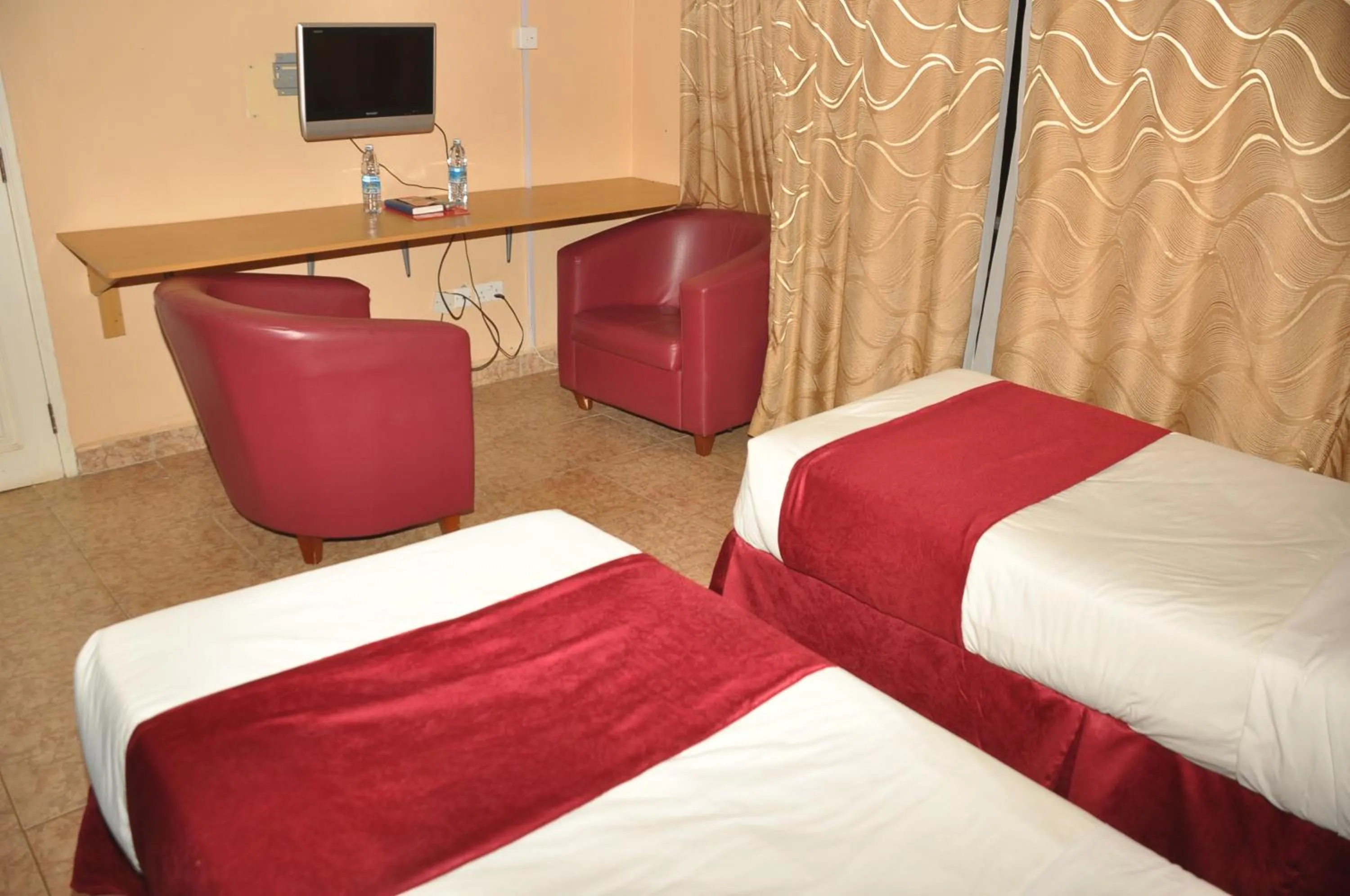 TV and multimedia, Bed in Eureka Place Hotel Kampala