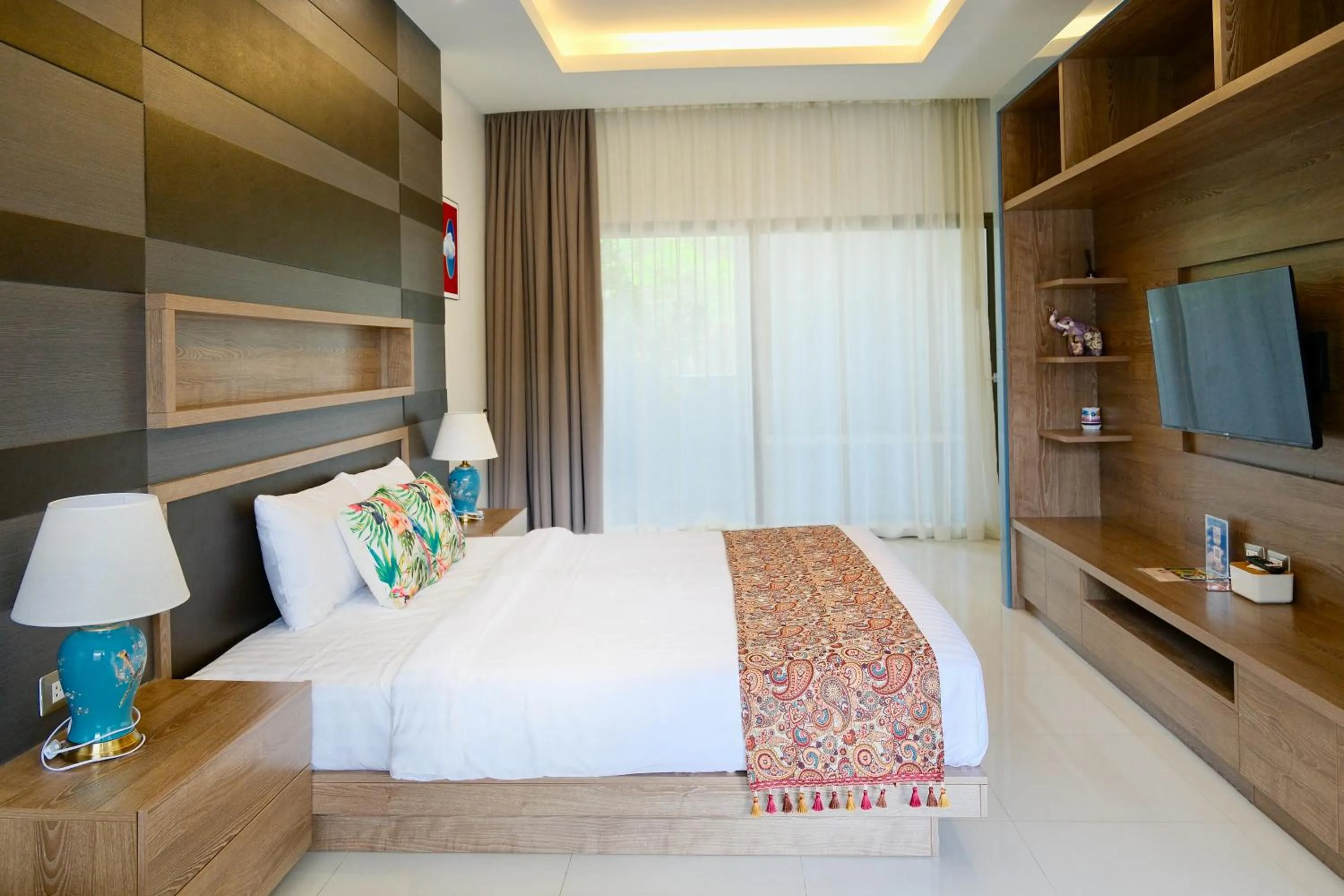 Communal lounge/ TV room, Bed in Phuket Moonlit Bay Seaview Resort & Spa